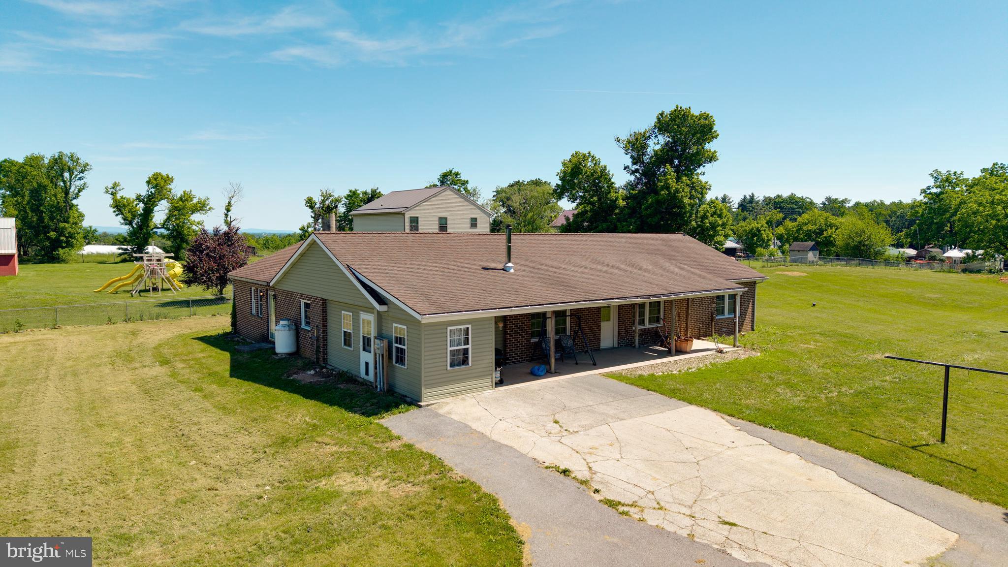 Solid Bones, Real Space, and Room to Make It Yours.
Brick ranchers don't come along often — and this 1988 all-brick home on 2.03 open acres in Franklin County delivers the kind of square footage and durability that's genuinely hard to find at this price. With over 2,500 finished square feet on one level plus a full basement, there's real room to live, work, and spread out.
The standout is the 19x28 kitchen — anchored by a large island, custom raised-panel cabinetry, double oven, propane cooktop, and recessed lighting. There's plenty of space to add appliances and make it entirely your own. The living room features a quality wood stove and wood wainscoting, creating a warm, inviting gathering space.
Major systems have been addressed: a 2021 Mitsubishi heat pump provides both heating and central air, 14 replacement windows were installed that same year, and a whole-house re-plumb was completed in 2025. The 33x8 covered front porch overlooks a fully chain-link fenced lot — practical for your pets, or simply enjoying the open countryside.
This property is priced for buyers who recognize value and are ready to add their own finishing touches. Conventional and cash financing. Schedule your private tour today.