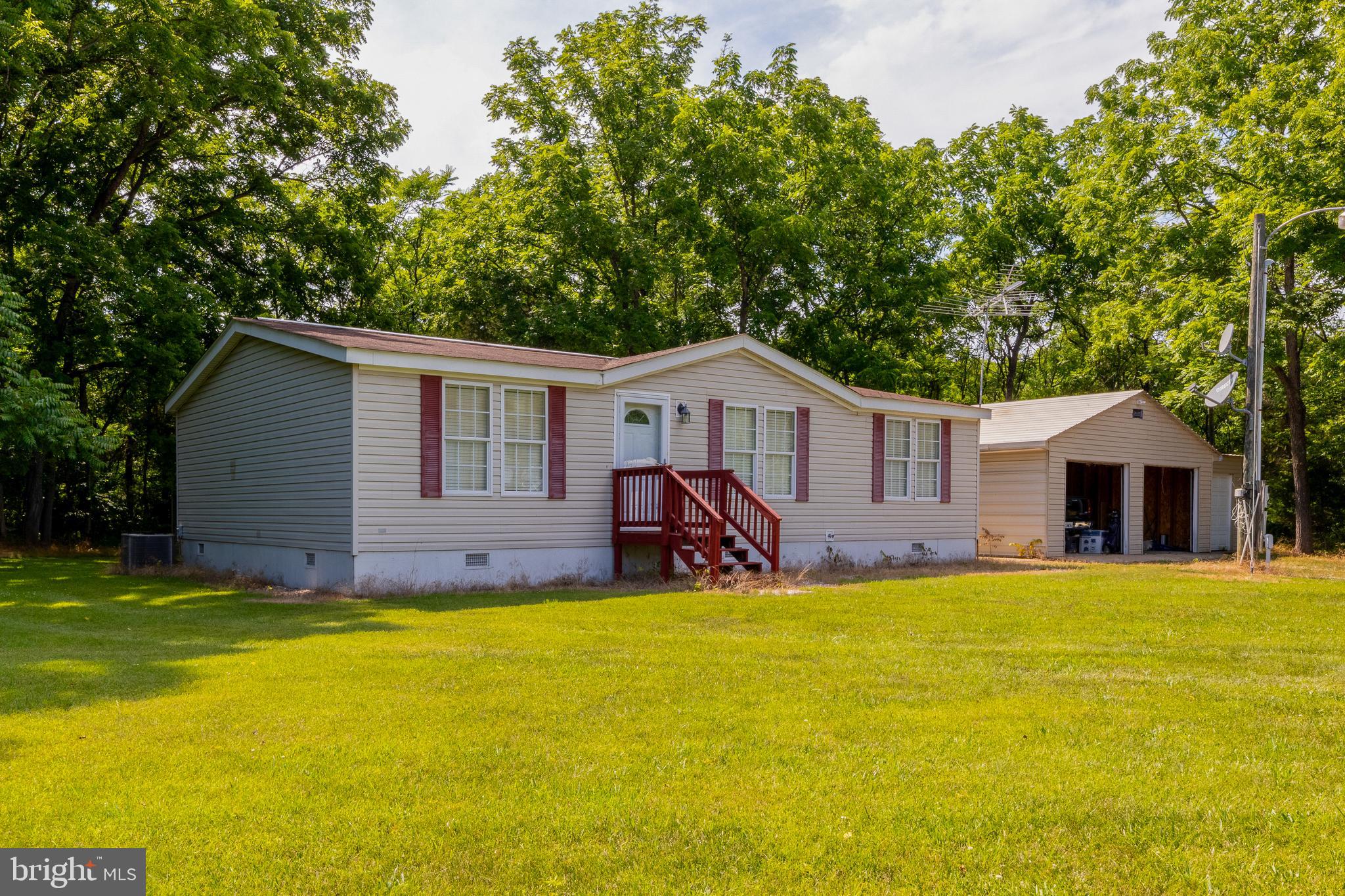 Double Wide  on permanent foundation with 2 x 6 walls.  Kitchen cabinets have hand made fronts out of oak.  all additional storage and furniture is hand made and is included in sale.  This home has been lightly lived in, only a few months each year an, and loved.