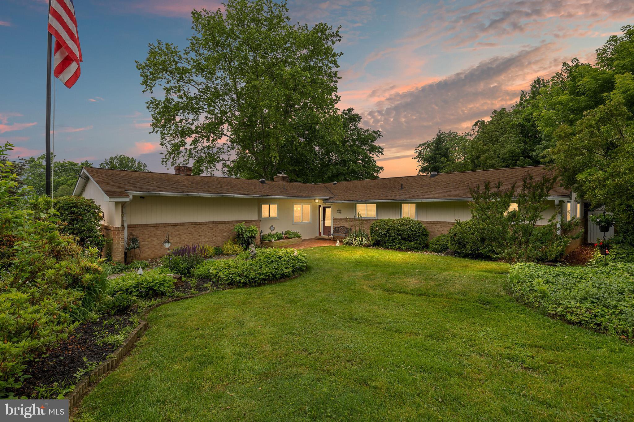 Nestled in the charming Ridgewood community, this beautifully maintained ranch-style home offers the perfect blend of comfort, functionality, and modern living. Built in 1960, the home features four spacious bedrooms and two-and-a-half bathrooms, providing plenty of room for everyday living and entertaining.

Step inside to discover a warm and inviting interior accented by hardwood and ceramic tile flooring throughout. The heart of the home is the expansive family room, seamlessly connected to the eat-in kitchen — an ideal layout for gatherings and everyday convenience. The kitchen is thoughtfully appointed with energy-efficient LG appliances, including a double oven and refrigerator, a Bosch dishwasher, massive pantry space, stunning Zodiac hard-surface countertops, and plenty of room to bring your culinary creativity to life.

The formal dining room is enhanced with crown molding and recessed lighting, creating an elegant setting for memorable meals. A spacious breakfast counter connects the dining area to the kitchen, offering additional casual seating and a natural gathering space for family and guests alike.

Additional living spaces include a welcoming living room, a cozy family room with a wood-burning fireplace, and a bright all-season sunroom that adds to the home’s exceptional flow and versatility.

The private primary suite serves as a relaxing retreat, complete with a luxurious well-appointed walk-in shower. Skylights throughout the home fill the space with abundant natural light, creating a bright and airy atmosphere.

Outside, the mature landscaping and extensive hardscape create a peaceful outdoor oasis. A workshop shed offers the perfect space for hobbies, projects, or additional storage. The attached garage provides convenient interior access, while the spacious driveway accommodates ample guest parking.

Included in the sale are exterior security cameras for added peace of mind. The spacious basement offers endless possibilities as a workshop, craft room, playroom, or additional living space. The easily accessible crawlspace and attic provide abundant storage options.

This exceptional property truly has it all — comfort, character, space, and style — all in a desirable North Wilmington location.