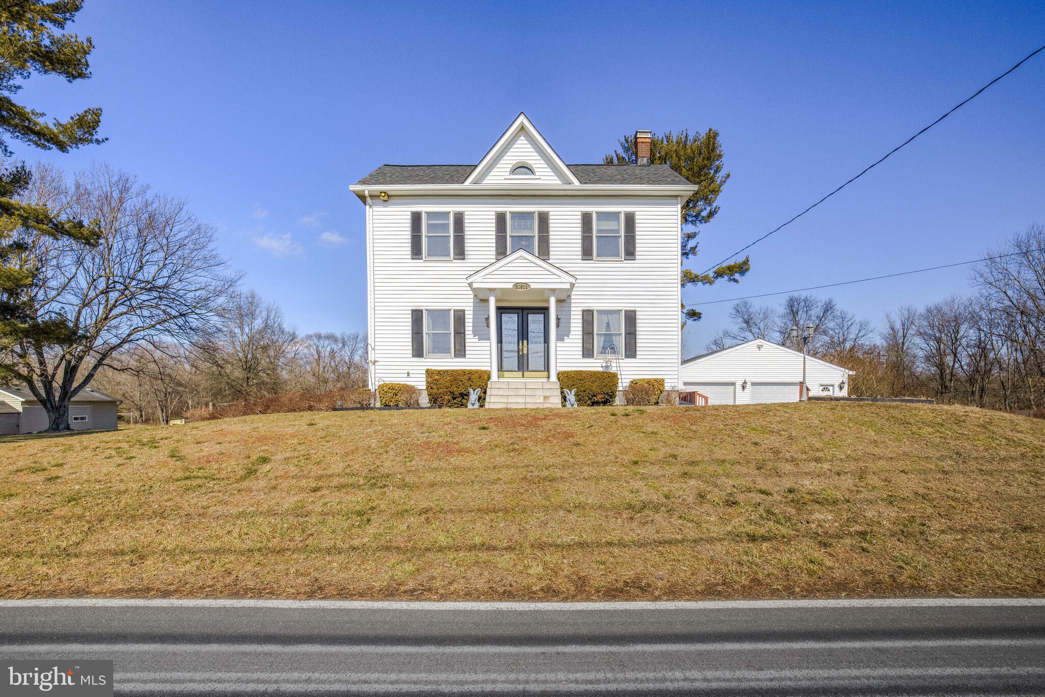 This is a truly unique Property.  The original 1800's house was enlarged in the 1970's and updated in the 2000's.  The main level features a formal dining doom with fireplace, kitchen with center island that has storage, wine rack, and seating, granite counters through out and updated appliances. There is a full bath on this level.   The living room has a fireplace and a desk area.  Walk out the French doors to a large deck that overlooks the 2.75 acres.  Upstairs are 4 good sized bedrooms and a full bath.  On the lower level is the fifth bedroom, the laundry room and half bath.  Additionally, a 2 car garage with work area and attic storage, and an additional storage shed.