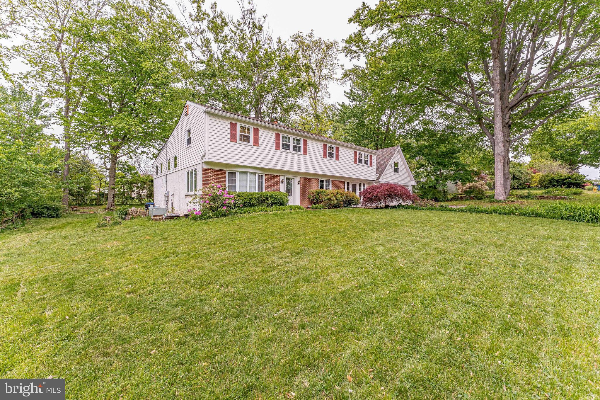 Welcome to 312 Penn Lane, a 3-bedroom, 2.5-bath split-level single-family home in the Glen Acres community of West Chester. As you approach, a two-car garage and spacious six-car driveway provide ample parking and convenience. The main level features a kitchen with quartz countertops, a center island, and stainless steel appliances, offering both functionality and style. This level also includes a family room, ideal for everyday living or entertaining, along with a convenient powder room. A breezeway from the kitchen adds flexible space that can be used as a sitting area, playroom, or additional living space. Upstairs, the second level includes a dining room with hardwood flooring, crown molding, and a ceiling fan, which flows into the living room featuring hardwood floors, crown molding, and a propane fireplace. A dedicated home office on this level includes hardwood flooring, exposed ceiling beams, wood wainscoting, and built-in cabinetry, creating a comfortable and functional workspace. The third level includes the primary bedroom with a ceiling fan and a spacious walk-in closet. The en-suite bathroom features tile flooring and a step-in shower. Two additional bedrooms, each with carpet flooring and ceiling fans, offer space for family or guests. A full hall bathroom with a tub and shower combination completes this level. The finished lower level provides additional living space with a rec room featuring ceiling beams and direct access to the backyard. The laundry room and home utilities are also located on this level. A finished room above the garage offers plenty of potential for a private office, media room or home gym. The fully fenced backyard offers plenty of space for relaxing or entertaining. Conveniently located near local shopping, grocery stores, dining, and entertainment, this home also provides easy access to downtown West Chester and Route 3. Don’t miss the opportunity to make 312 Penn Lane your new home.