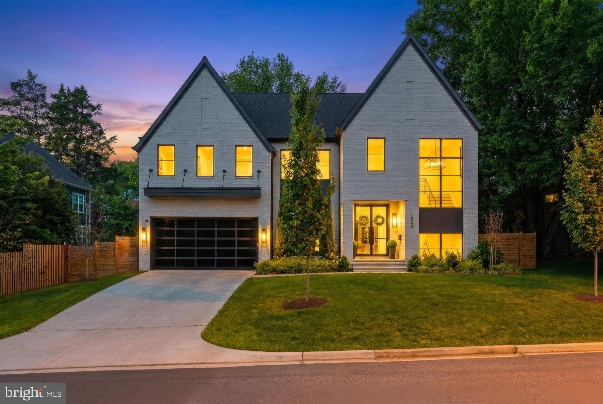Open House this Saturday from 1pm - 3pm!

Elevate your lifestyle in this magnificent Modern Tudor masterpiece! The home offers an impressive 6 bedrooms and 6.5 baths, featuring a convenient 8' tall cab elevator servicing all floors. As you step inside, an inviting sun-filled formal entry beckons, setting the stage for the opulence that awaits. The entire first floor boasts exquisite white oak wire-brushed engineered hardwood floors, creating a seamless and sophisticated canvas for the home.

Custom steel railings with horizontal steel pickets infuse a modern aesthetic and guide you through this architecturally distinguished residence. With 10-foot ceilings on the main floor, the sense of space and grandeur is undeniable, while the basement and upper levels maintain a comfortable 9-foot ceiling height, ensuring a harmonious flow.

For culinary enthusiasts, the chef's dream kitchen package is nothing short of extraordinary. Adorned with beautiful custom maple cabinets in a custom paint color, stacked wall frameless cabinets that reach the ceiling, an oversized waterfall island with a convenient prep sink, and top-of-the-line Sub-Zero and Wolf appliances, this kitchen is a true masterpiece. The main level further impresses with a generously sized dining room, a spacious living room, a screened-in porch, and a flexible room that features an ensuite full bathroom, providing the versatility to serve as an additional bedroom or a study.

The primary suite includes a luxurious custom closet, and the master bathroom boasts a freestanding soaking tub and a generously sized custom shower. A heated towel rack adds a touch of comfort, transforming daily routines into moments of indulgence. Three additional bedrooms, each with ensuite baths, provide unparalleled comfort and convenience.

The lower level is a haven of entertainment, featuring an au pair suite with a full bathroom, an open theater/rec room, an exercise room, and a billiard room, ensuring there's something for everyone to enjoy. The mixologist-inspired full bar is the perfect space for hosting memorable gatherings.

This home has been meticulously designed with extensive phone, data, HDMI, and surround sound capabilities, along with a 3-zone Wi-Fi NUVO Sound System, perfect for the tech-savvy homeowner. Your peace of mind is ensured with the premium security system package, including an 8-zone CCTV system with remote viewing.

A beautifully landscaped yard completes this property, featuring a custom fencing that enhances both privacy and aesthetics. Welcome to a new standard of luxury living, where contemporary aesthetics meet practical functionality to create your dream home.