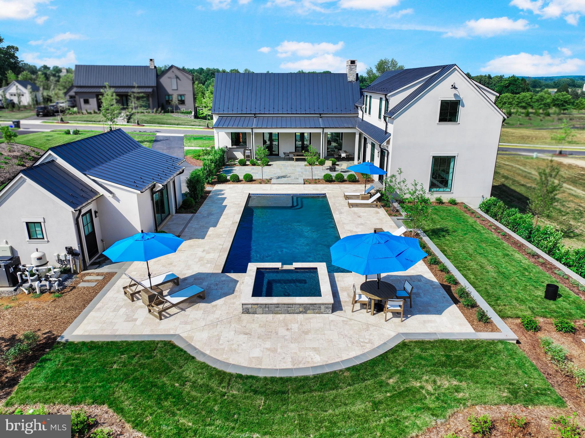 Located in the exclusive Residences at Salamander community, one simply cannot build this home —with all of its custom finishes—at this price. What began as the base Vineyard model has been transformed into a one-of-a-kind property situated on the largest lot in the Vineyard neighborhood. This light filled home with eight additional windows and designer lighting has over $900k in upgrades, exceeding the most discerning expectations. Experience resort-style living with a 42' x 18' heated saltwater pool, a luxurious 8' x 8' spa for year-round relaxation and pool house with full bathroom. The heart of the home features a fully equipped gourmet kitchen that flows seamlessly into a stunning great room overlooking the professionally landscaped courtyard and garden. Custom enhancements include wood ceiling beams, a bespoke dry bar with custom wood shelving, and a wine refrigerator—perfect for the wine connoisseur. The first floor also includes a den with fireplace and full bathroom, a spacious first-floor ensuite primary bedroom featuring a garden view and direct access to the pool, spa, and courtyard areas. Upstairs boasts two private and light-filled ensuite bedrooms each with an additional window, and enhanced ceiling height in the rear bedroom and in the cozy reading nook landing. The completely finished lower level expands your living space exponentially with the additional ensuite bedroom with tray ceiling, walk-in closet and large windows. The lower level also features a dedicated home gym with natural light, two full bathrooms and a generously-sized game room perfect for gatherings. Outside includes additional parking for guests, a grill center, and professionally designed landscaping with flagstone and travertine terraces offering multiple outdoor living zones. All of this in addition to enjoying the amenities of The Residences at Salamander and living in one of Virginia's most celebrated destinations.