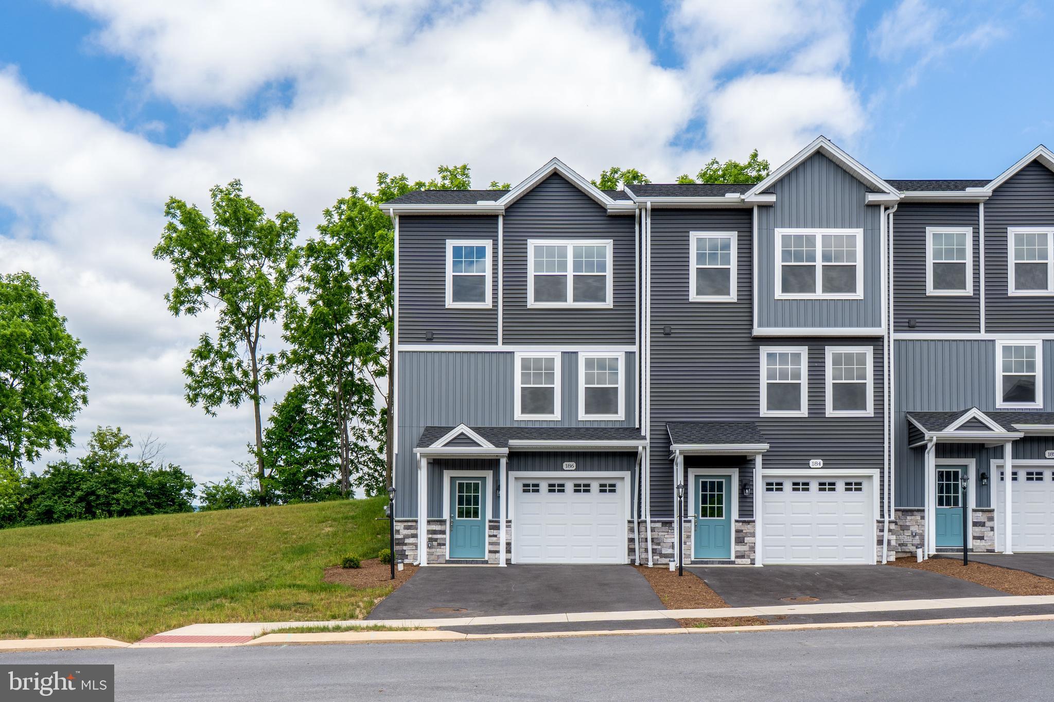 Steeplechase offers a suburban setting with walking paths and landscaped common areas, located 5 minutes from I-99, near Historic Bellefonte, and 10–15 minutes from Penn State University. 

The Redfield end-unit plan features a kitchen with quartz countertops, upgraded cabinetry, a center island with overhang, and Whirlpool appliances, including a smooth top range, microwave, and dishwasher. Wafer LED lighting is included throughout. A 10' x 10' pressure-treated deck provides outdoor space. The owner’s suite includes a private bath, and second-floor laundry adds convenience. The home also includes an unfinished  basement, a garage door opener, and central air.

Contact us for more details on this home.