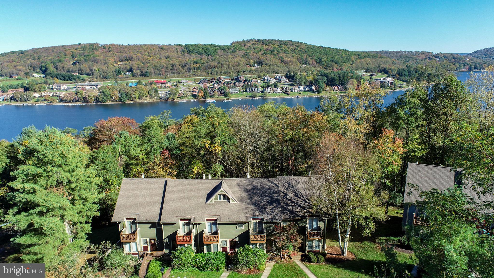 Welcome to 5 Lakeview Court, McHenry, MD – Your Four-Season Mountain & Lake Retreat!
Located in the Villages of the Wisp community, this well maintained 3-bedroom interior unit with an additional loft offers the ultimate Deep Creek Lake lifestyle with both ski access and lake access! With over 1900 square feet of finished living space, this unit offers the largest floorpan at Villages of Wisp. 
Step inside to find a warm and inviting layout, perfect for entertaining or relaxing after a day on the slopes. The open-concept living area features a cozy fireplace and plenty of natural light throughout. Upstairs, the spacious loft provides extra sleeping space, a home office, or a game area. In winter, take advantage of direct ski slope access just minutes from your door. In warmer months, enjoy private community lake access with a dedicated lakeside park —ideal for swimming, kayaking, and soaking in lakefront sunsets. Whether you're looking for a mountain getaway, year-round residence, or a strong rental investment, this unit has it all. Roof and water heater have been recently replaced. Don’t miss the opportunity to own in one of Deep Creek’s most desirable communities! Property being sold as-is.