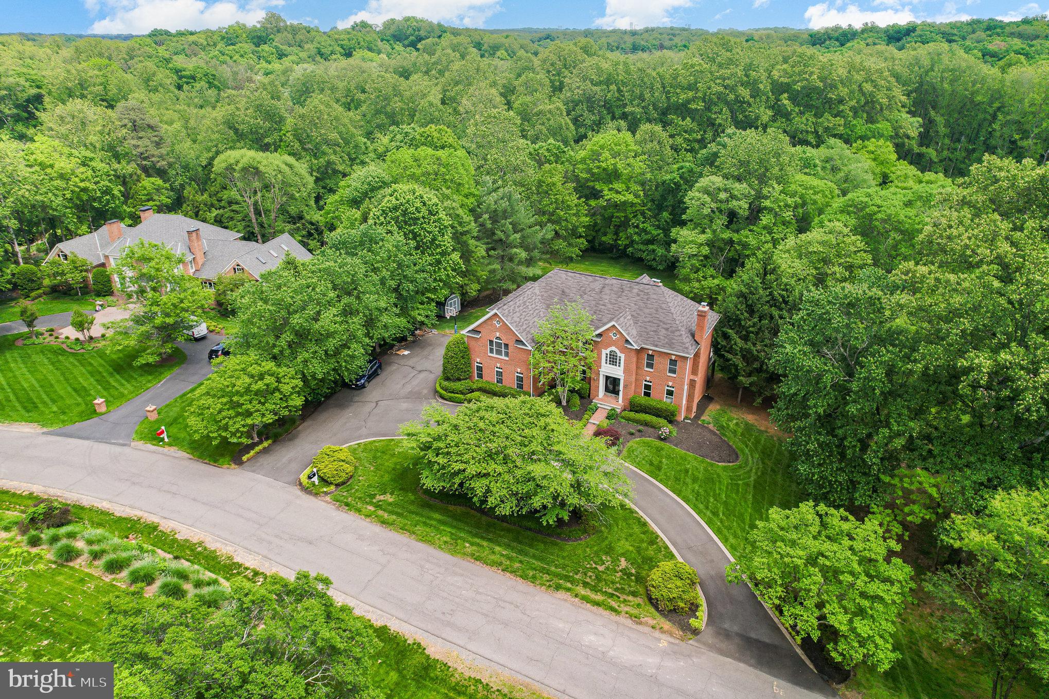 Discover this exquisite luxury residence at 2091 Hunters Crest Way, Vienna, VA—an expansive home designed for comfort, elegance, and seamless entertaining. Boasting six spacious bedrooms and five full bathrooms, this exceptional property combines sophisticated finishes with practical living spaces.

The main level welcomes you with gleaming hardwood floors and a striking vaulted two-story foyer that leads into a grand great room with built-in cabinetry and a cozy gas fireplace—perfect for relaxing or hosting guests. The formal dining and living rooms offer elegant settings, complete with another inviting gas fireplace to create warm ambiance. A dedicated home office with French doors provides a quiet workspace, while the gourmet kitchen shines with refinished cabinets, a large center island, new quartz countertops, and top-of-the-line appliances. Enjoy casual meals in the attached breakfast room, or soak up the sunlight in the adjacent sunroom.

Upstairs, the luxurious primary suite features a comfortable sitting area, an enormous walk-in closet, and a renovated primary bathroom—your private retreat. The princess suite offers its own en-suite bathroom, while two additional guest bedrooms share a convenient Jack-and-Jill bath.

The fourth level includes a beautifully refinished suite with an en-suite bath, a spacious attic for ample storage, and new carpeting throughout. The finished basement is an entertainer’s paradise, complete with a state-of-the-art theater room, a large game and recreation room with a gas fireplace, and a fully finished bedroom with an additional full bath. The wet bar creates the perfect setting for game nights, entertaining, or relaxing, complemented by an attached den ideal for a home gym, secondary office, or storage.

This luxurious home offers a perfect blend of elegance and functionality in a sought-after Vienna location—an impeccable place to call your next home.

Situated on almost 2 acres on a private street the home also features a 3 car garage, circular driveway and on street parking for those that love to entertain.  The exterior deck has been completely refinished and overlooks the large lawn and mature trees.

Roof 2015
Complete Brand New Upgraded Heat Pump with lifetime Warranty (approximately 2 years old) 

Complete Brand New HVAC / Furnace System with lifetime Warranty (approximately 2 years old) 

(Both Systems are complete top of the line and were around 60K) 

Refinished Wood Floor 1st, 2nd Floor (4 years old) 

New Flooring Basement Level (3 years old) 

New Top of the line 75 Gallon Hot Water Heater (october) 

New Dual Sump Pump / Battery Pack Up (october) 

Brand New Well Pump (4 years old) 

Brand New Garage Floor

Brand New Lit Stone Walkway to Ground Floor  (30K upgrade) 

New Sound Suppressed Home Theater included (14.1 ATMOS), Theater Front Wall, New Projector, Upgraded Wall Unit (35K upgrade) 

House completely Repainted Inside 

All Fireplaces Were Repaired and in full working order 

New Compressor in Main Fridge (2 years old) 

brand new high end Garage Door Opener just installed in the last 6 months