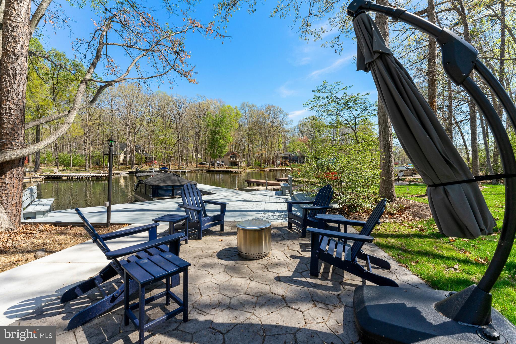 FANTASTIC PRICE!!  This is your chance to get fabulous waterfront property for an amazing price! Don’t miss your opportunity to tour this beautiful lakefront home with stunning water views, private dock, and numerous recent upgrades. Schedule your showing today before it’s gone! 
Recent Updates Include: New HVAC (2024); EV/RV hookups + electric dog fence (2024); fresh paint + wainscoting (2024); expanded driveway (2025); concrete walkways & retaining wall (2025); tree clearing; new stainless steel Whirlpool refrigerator (2024); added lighting; new sod + landscape lighting (2025).

Waterfront retreat at Lake of the Woods!  Experience lakeside living in this beautiful, meticulously maintained, two-level waterfront home, perfectly situated on a private 550-acre lake. 

Featuring 4 bedrooms and 3 full baths, the open-concept layout is designed to maximize both comfort and stunning water views. The welcoming layout features  scenic water views from the kitchen, dining, and living areas. The kitchen features updated countertops, new refrigerator and a wall of windows fills the home with natural light while showcasing the peaceful lake setting.
The walk-out lower level offers a spacious recreation room, along with a flexible bonus space ideal for a home office or workout area.
Enjoy outdoor living with expansive decking—perfect for relaxing, entertaining, or simply taking in the serene surroundings. The new concrete walkways provide easy access to the waterfront deck and boat slip, enhancing both convenience and durability.
This property offers the ideal full-time residence or weekend getaway with direct lake access and your own private dock.