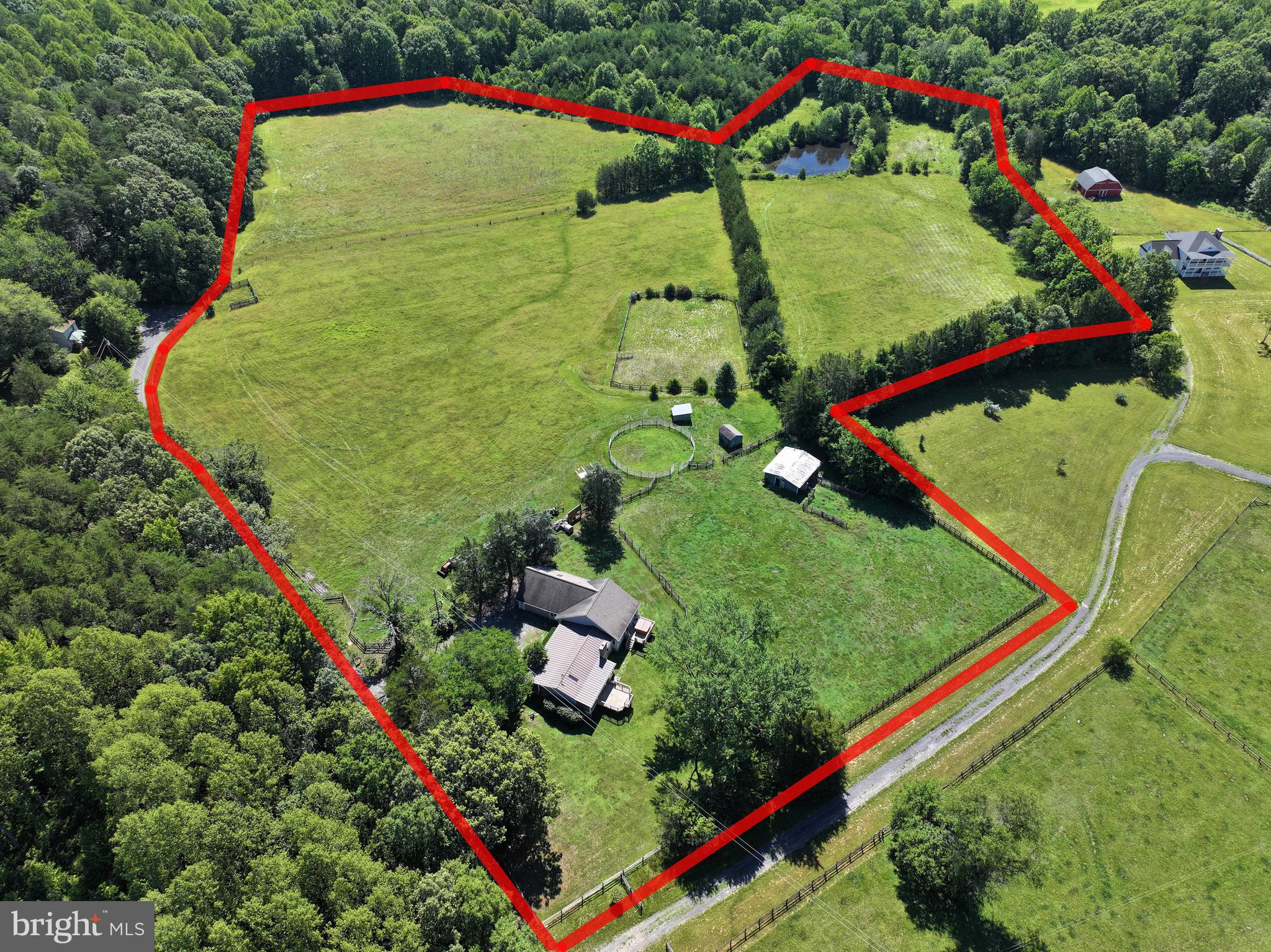 Tucked away from the pace of city life, yet conveniently located within 20 minutes of major shopping and dining, 6317 Louisianna Road offers the opportunity to embrace a quieter way of living on 16.07 acres with no HOA. Whether you envision bringing horses, cattle, barn animals, or simply enjoying the freedom that comes with wide open space, this property provides the setting to create the rural lifestyle you've been dreaming of.

As you arrive, the welcoming front porch swing and beautiful stone siding create an immediate sense of home. Step inside and you're greeted by an abundance of natural light that fills the living room, highlighting the rich hardwood floors and inviting atmosphere. This is the kind of space where mornings begin slowly with a cup of coffee and evenings are spent unwinding after a day outdoors.

To the right of the living room, the kitchen and dining area offer a comfortable gathering space for everyday meals and special occasions alike. Tile flooring provides durability, while large windows overlooking the deck bring the outdoors in. A skylight above the dining area bathes the space in additional natural light, creating a bright and cheerful setting throughout the day. Tucked neatly behind closet doors, the laundry area is conveniently located within the dining room. An additional exterior entrance, built-ins, and a small pantry add functionality to this well-designed area of the home. A conveniently located half bath sits between the kitchen and living room.

The bedroom wing offers privacy and flexibility. Two comfortably sized, carpeted bedrooms provide space for family, guests, or a home office. An additional oversized bedroom is situated above the garage and can be accessed either through the second bedroom or directly from the garage staircase. With two skylights overhead, this unique space feels bright, open, and full of possibilities.

At the end of the hall, the spacious primary suite serves as a peaceful retreat. French doors welcome you into the room, while its position overlooking the backyard creates a sense of privacy. The ensuite bathroom features a soaking tub perfectly positioned to take in views of the expansive backyard, along with a separate stand-up shower. Back in the bedroom, a private door leads directly to a separate rear deck complete with a hot tub hookup, offering the potential for a relaxing outdoor escape just steps from your bed.

Outside, the acreage provides room to roam, garden, explore, or simply enjoy the beauty of country living. An additional door from the living room opens to the backyard and offers the opportunity to add another deck, creating even more outdoor living space to enjoy the surrounding property.

Ready for its next chapter, 6317 Louisianna Road offers space, flexibility, and the freedom to make it your own.