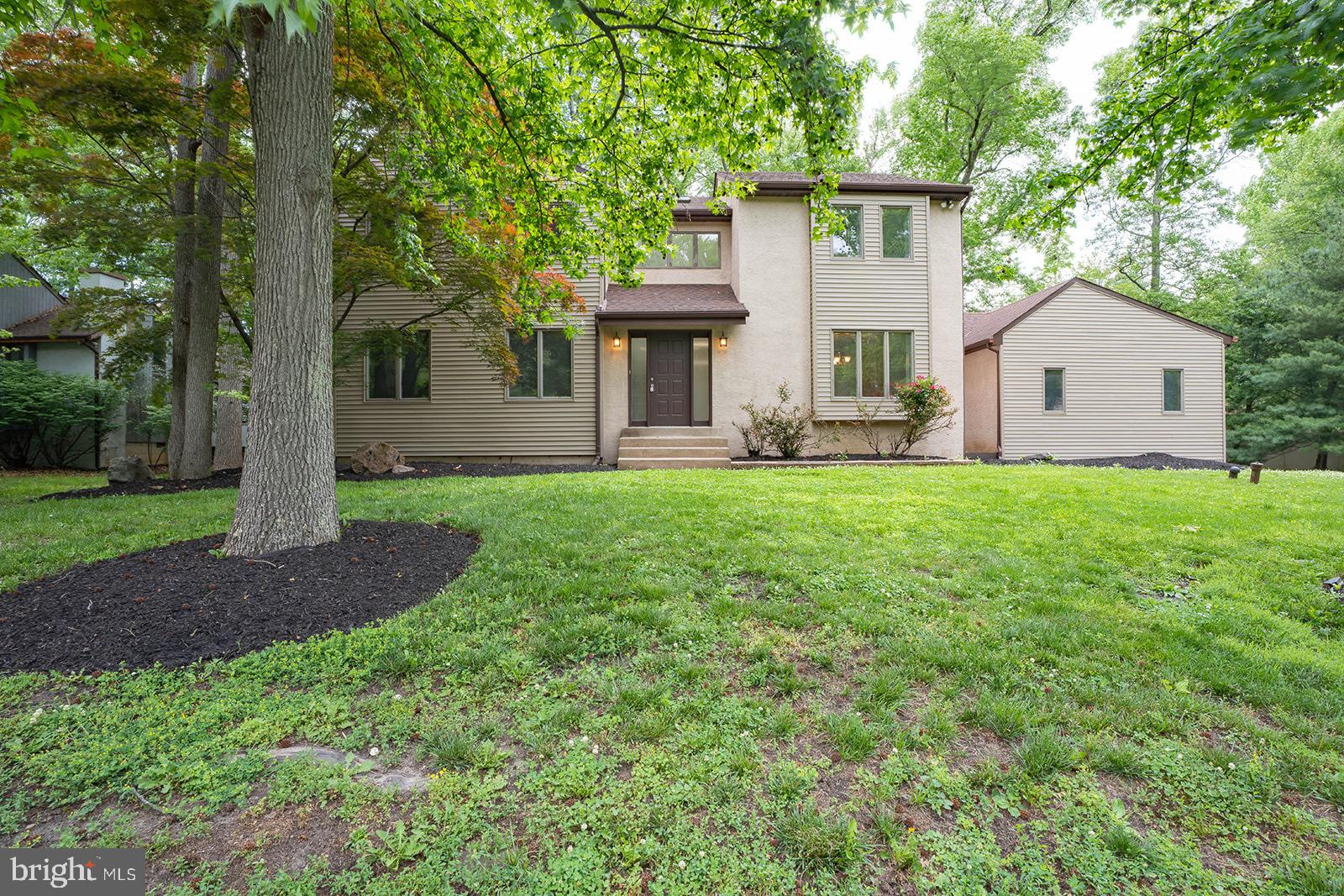 Nestled on a picturesque .41-acre wooded lot, this stunning contemporary home offers the perfect blend of style, comfort, and exceptional living space. From the moment you step into the dramatic two-story foyer, you’ll appreciate the bright, open floor plan designed for both everyday living and entertaining. The elegant living and dining rooms feature gleaming hardwood floors and an airy, welcoming atmosphere. The kitchen is sure to impress with upgraded cabinetry, granite countertops, stainless steel appliances, newly tiled flooring, and a sunny breakfast area with sliding doors leading to the expansive rear deck. The inviting family room is the heart of the home, highlighted by a cozy brick gas fireplace with mantel and additional sliding glass doors that seamlessly connect indoor and outdoor living. A convenient powder room and laundry room complete the main level. Upstairs, the spacious primary suite provides a peaceful retreat with a walk-in closet and en-suite bath featuring a stall shower, oversized Jacuzzi tub, and skylight. Three additional generously sized bedrooms and a full hall bath with double vanity and tub/shower offer plenty of room for family and guests. Step outside to the oversized deck overlooking the backyard and mature shady trees — the perfect setting for relaxing, entertaining, or enjoying nature’s beauty. Additional features include a full basement, two-car side-entry garage, fresh paint, new carpeting and flooring, and numerous updates inside and out. Ideally located just minutes from I-95, Route 1, Trenton and Mercer train stations, and Philadelphia and Mercer airports, this home also offers easy access to the charming boroughs of Yardley, Newtown, and New Hope with their wonderful restaurants, boutiques, and local attractions. Located within the highly acclaimed Pennsbury School District, this exceptional property truly has it all.