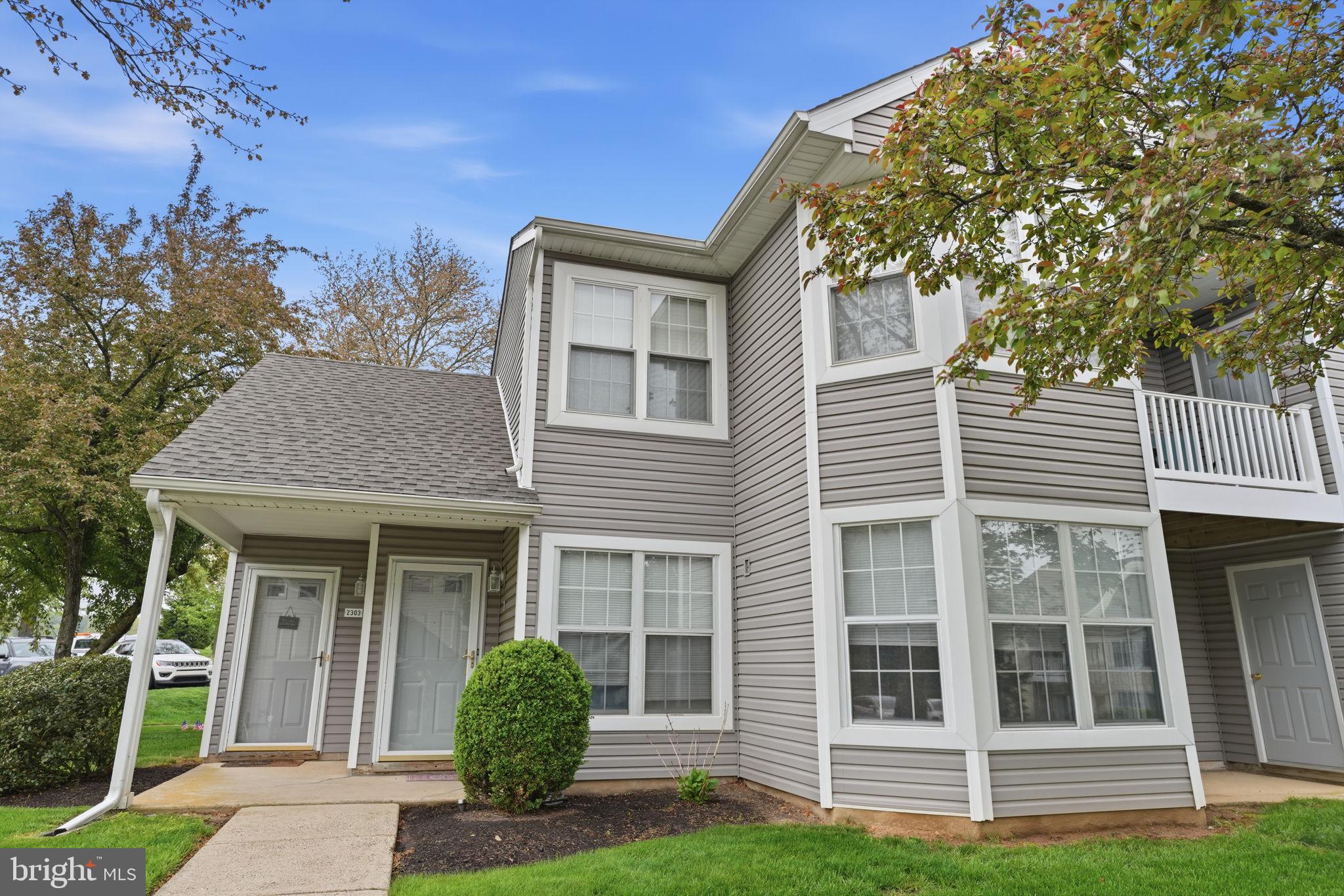 Welcome home to this second-floor condominium located in the highly sought-after Council Rock School District. Tucked away at the end of the community, this unit offers both privacy and a peaceful setting. A convenient storage closet is located at the entry before heading upstairs, adding to the home’s practical appeal.  Inside, you’ll find a bright and inviting living and dining area featuring vaulted ceilings that create an open, airy feel. The living room is enhanced with crown molding and a ceiling fan, while the dining room is filled with natural light and offers sliding glass doors leading to a covered balcony—perfect for relaxing or enjoying your morning coffee. The kitchen has granite countertops and a tile backsplash, providing both style and functionality. The spacious primary bedroom features two closets with organizers, a ceiling fan, and an updated en-suite bathroom complete with tiled flooring, a beautifully tiled shower with built-in niches, and a convenient medicine cabinet. A second bedroom and a full hall bathroom with ceramic tile flooring offer flexible space perfect for guests, a home office, or everyday living. This well-maintained community offers great amenities including a swimming pool, tennis courts, and a tot lot, all in a prime location close to shopping, dining, and major roadways. This is a wonderful opportunity to enjoy low-maintenance living.