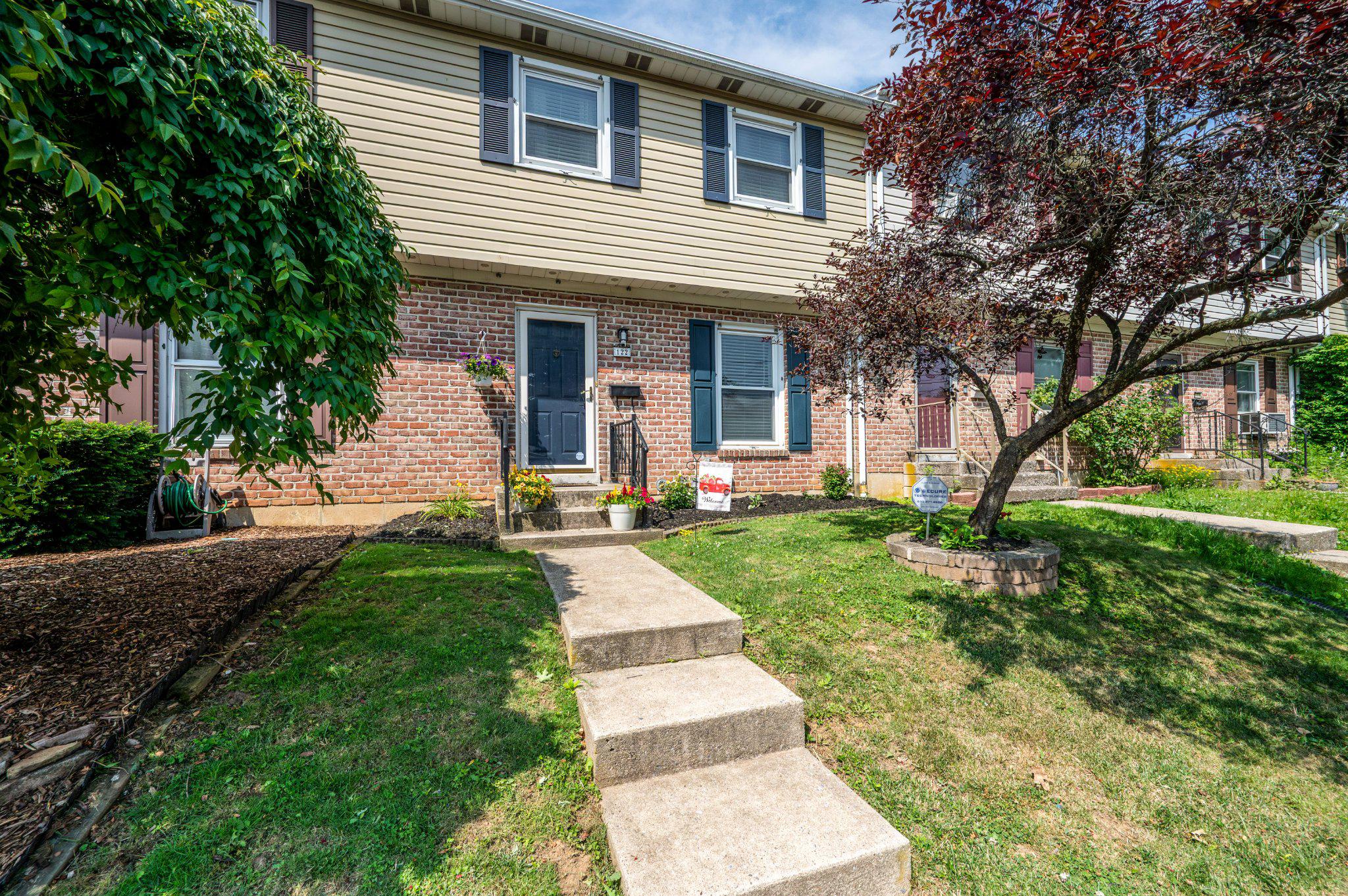 Open House Saturday, 7/25 12:00 -1:30 at 122 N 7th Street which is along one of Emmaus’s most walkable, tree lined streets stands a beautifully updated townhome that pairs low maintenance living with genuine small town character. A tastefully landscaped, inviting Entry sets the tone before you even step inside, softening the approach along this established block. Step inside and that same sense of care continues throughout: fresh paint, upgraded lighting fixtures, and upgraded flooring carry a polished, cohesive feel from room to room, presenting a true move in ready canvas just steps from the shops and restaurants of Main Street. The Living Room opens wide and bright, running the full width of the home. Upgraded lighting and flooring set an elevated, welcoming tone that carries seamlessly into the rooms beyond. From there, the space flows naturally into the Kitchen and Dining area, where generous counter space, ample cabinetry, and upgraded lighting overhead make room for both quiet weeknights and easy entertaining, while a comfortable Dining area offers a natural gathering point for morning coffee or a shared meal at the end of the day. A convenient Half Bath rounds out the lower level, a valuable convenience for daily life and for guests.
Upstairs, three well proportioned Bedrooms continue the home’s cohesive finishes, each offering closet storage and natural light, with enough flexibility to serve as a primary retreat, a guest room, or a home office as life requires. A spacious full hallway Bath completes the second floor, finished to match the tone of the rest of the home. Below, a finished Lower Level extends the living space further still, offering meaningful bonus square footage. Suited equally to a Family Room, a home gym, or a private office, it lends the home a versatility that evolves alongside its next owner.*Bonus, electric baseboard heating as a back up!  Outside, a rear Deck offers a spot to relax or entertain, extending the home’s living space into the open air. Alongside it, a small rear yard and off street parking sit side by side, a practical and convenient combination for this part of Emmaus. Set in the heart of Emmaus, the location offers effortless access to the Triangle, the borough’s beloved downtown hub of shops, restaurants, and the seasonal farmers market, along with Community Park, only a few steps to the famous Halloween parade route and the South Mountain trails. From here, the commute to Allentown and the greater Lehigh Valley is equally straightforward via Route 29, Lehigh Street, and Interstate 78.