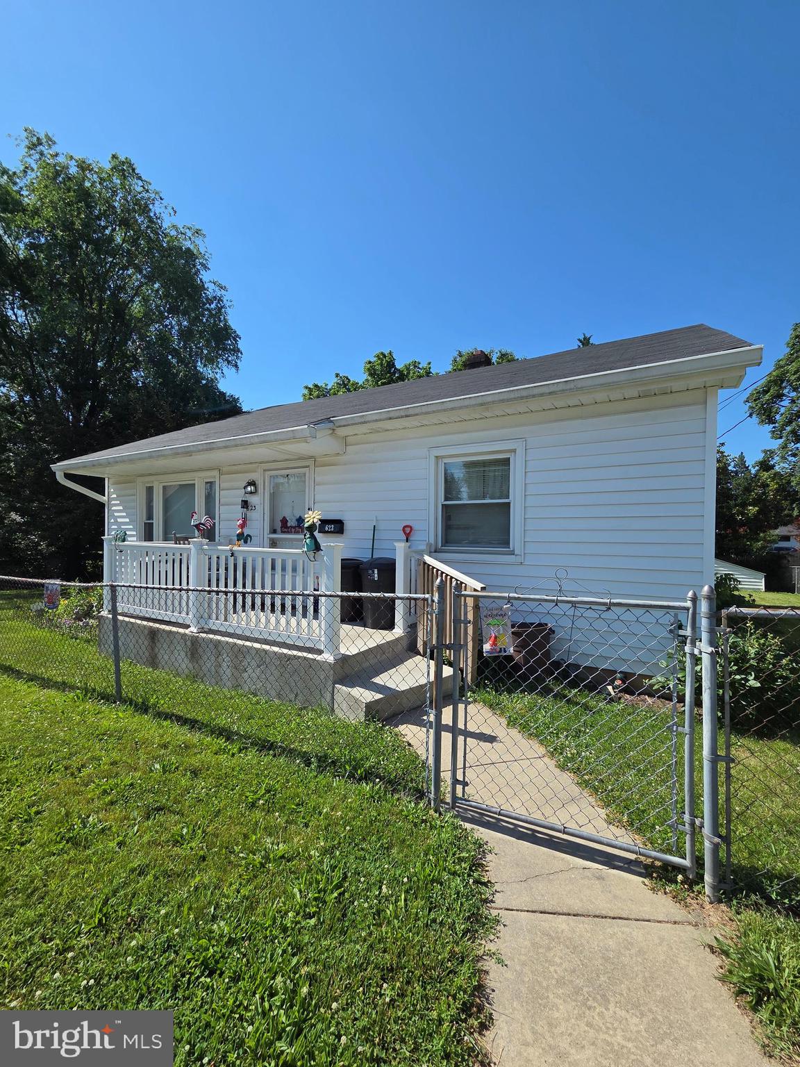 Cute as a button!  One level ranch with a fully fenced level yard. Newer items include oven, refrigerator, portable dishwasher, HVAC, Electrical panel updated and a walk-in shower. Original hardwood floors in the living room, hallway and bedrooms.  One of the bedrooms has the washer and dryer, but you could set it up in the basement as well. There is a small porch on the front of the home and a spacious deck off the kitchen.  Make your appointment today!