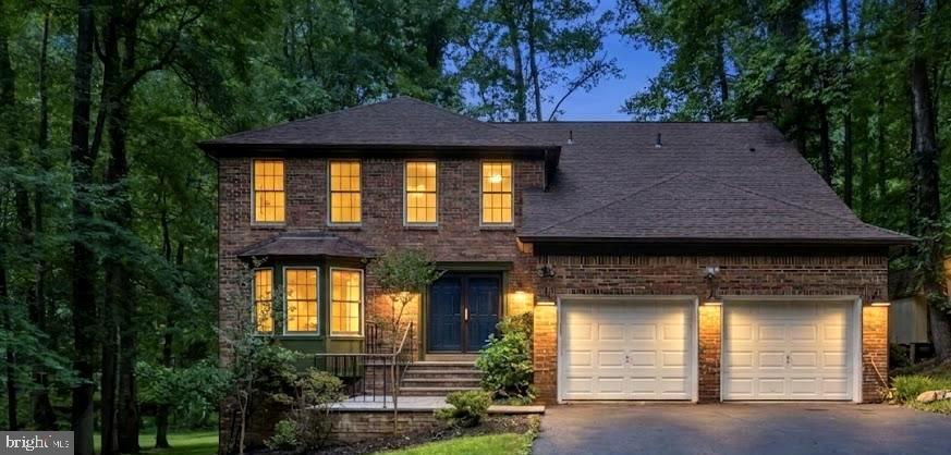 Prepare to be captivated from the moment you arrive at this striking brick-front estate, tucked away on a premium, park-like 1.23-acre private cul-de-sac lot in the exclusive King George Estates enclave of Pomfret. Approached by elegant, brand-new paver entry steps, this residence masterfully pairs turnkey designer luxury with unparalleled functional upgrades that simply cannot be replicated in standard new construction today.  The grand foyer sets an unforgettable, magazine-worthy tone for the entire home, greeting you with a breathtaking architectural stairwell featuring brand-new, custom modern black horizontal railings that beautifully accent the luxurious, wide-plank White Oak engineered hardwood flooring flowing seamlessly across the main level, upper levels, and stairs.  Bathed in natural light and anchored by a fresh, designer-curated neutral paint palette and crisp square-profile baseboard trim, every room feels bright, expansive, and effortlessly contemporary.  The heart of the home is a chef’s and host's dream, where the sunlit kitchen boasts a custom-built professional coffee bar station and brand-new custom pantry cabinetry optimized for baking supplies and extra storage.  Elegant new patio French doors swing open from the kitchen to a massive, freshly stained 500-square-foot rear deck, creating a seamless indoor-outdoor flow perfect for entertaining against a private, mature treeline. On the main level, you can relax in the expansive, sunken family room anchored by a stunning custom architectural accent wall and a fully updated, stylized fireplace hearth. Guests will love the chic main-level powder room, highlighting an organic, Bali-inspired artisan accent wall, a modern basin sink, and upgraded contemporary lighting.  The luxury continues upstairs where you can unwind in a true spa-inspired primary ensuite featuring a massive, custom porcelain tile shower stall, a standalone deep soaking tub, dual premium vanities, and furniture-grade luxury cabinetry.  Organization is an art form here, featuring dual "His & Hers" walk-in closets completely outfitted with heavy-duty architectural built-ins and an integrated functional laundry chute. All secondary bedrooms feature custom built-in closet organization systems, with select rooms boasting integrated floating nightstands, while the updated secondary bath offers its own spa-inspired tile shower and beautiful cabinetry.  Even the modernized laundry room is upgraded with highly durable contemporary flooring, a custom storage closet system, and a built-in ironing board.  Beyond the main living spaces, this property delivers incredible functional bonuses, including an attached 2-car garage that has been transformed into a fully insulated, climate-controlled sanctuary featuring robust 4x6 wall construction and two brand-new garage door openers with remotes—making it the ultimate year-round workshop or private home gym.  Additionally, an eight-foot-tall standing crawl space with windows offers unprecedented multi-purpose utility and massive storage potential.  Enjoy the absolute peace, quiet, and security of rural-feel Maryland living without sacrificing daily convenience. Located just minutes from Route 301, shopping, and dining in La Plata and Waldorf, you will enjoy an effortless commute to DC, Andrews Air force Base & Dahlgren. A custom home of this caliber on a lot of this size in Pomfret is a rare find—schedule your tour today!