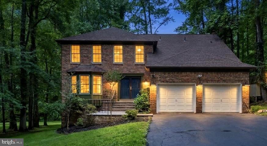 Prepare to be captivated from the moment you arrive at this striking brick-front estate, tucked away on a premium, park-like 1.23-acre private cul-de-sac lot in the exclusive King George Estates enclave of Pomfret. Approached by elegant, brand-new paver entry steps, this residence masterfully pairs turnkey designer luxury with unparalleled functional upgrades that simply cannot be replicated in standard new construction today.  The grand foyer sets an unforgettable, magazine-worthy tone for the entire home, greeting you with a breathtaking architectural stairwell featuring brand-new, custom modern black horizontal railings that beautifully accent the luxurious, wide-plank White Oak engineered hardwood flooring flowing seamlessly across the main level, upper levels, and stairs.  Bathed in natural light and anchored by a fresh, designer-curated neutral paint palette and crisp square-profile baseboard trim, every room feels bright, expansive, and effortlessly contemporary.  The heart of the home is a chef’s and host's dream, where the sunlit kitchen boasts a custom-built professional coffee bar station and brand-new custom pantry cabinetry optimized for baking supplies and extra storage.  Elegant new patio French doors swing open from the kitchen to a massive, freshly stained 500-square-foot rear deck, creating a seamless indoor-outdoor flow perfect for entertaining against a private, mature treeline. On the main level, you can relax in the expansive, sunken family room anchored by a stunning custom architectural accent wall and a fully updated, stylized fireplace hearth. Guests will love the chic main-level powder room, highlighting an organic, Bali-inspired artisan accent wall, a modern basin sink, and upgraded contemporary lighting.  The luxury continues upstairs where you can unwind in a true spa-inspired primary ensuite featuring a massive, custom porcelain tile shower stall, a standalone deep soaking tub, dual premium vanities, and furniture-grade luxury cabinetry.  Organization is an art form here, featuring dual "His & Hers" walk-in closets completely outfitted with heavy-duty architectural built-ins and an integrated functional laundry chute. All secondary bedrooms feature custom built-in closet organization systems, with select rooms boasting integrated floating nightstands, while the updated secondary bath offers its own spa-inspired tile shower and beautiful cabinetry.  Even the modernized laundry room is upgraded with highly durable contemporary flooring, a custom storage closet system, and a built-in ironing board.  Beyond the main living spaces, this property delivers incredible functional bonuses, including an attached 2-car garage that has been transformed into a fully insulated, climate-controlled sanctuary featuring robust 4x6 wall construction and two brand-new garage door openers with remotes—making it the ultimate year-round workshop or private home gym.  Additionally, an eight-foot-tall standing crawl space with windows offers unprecedented multi-purpose utility and massive storage potential.  Enjoy the absolute peace, quiet, and security of rural-feel Maryland living without sacrificing daily convenience. Located just minutes from Route 301, shopping, and dining in La Plata and Waldorf, you will enjoy an effortless commute  Washington, D.C. A custom home of this caliber on a lot of this size in Pomfret is a rare find—schedule your tour today!