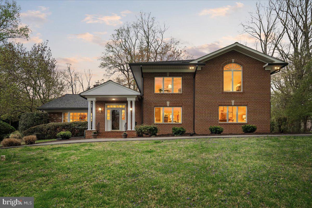 PRICE REDUCTION!! Nestled in the prestigious Potomac Manor, this exquisite Colonial-style residence offers a harmonious blend of timeless elegance and modern luxury. Beautifully situated moments from the charm of Potomac Village, the scenic C&O Canal trails, and the breathtaking beauty of Great Falls Park, all with convenient access to Washington, DC and Northern Virginia. Spanning an impressive 5,312 square feet, this home is designed for both comfort and sophistication, making it the perfect sanctuary for those who appreciate the finer things in life. Step inside to discover a warm and inviting interior adorned with solid hardwood flooring and crown moldings that exude charm. The spacious layout features five generously sized bedrooms and four and a half bathrooms, including a primary suite that boasts a luxurious jetted tub and a walk-in shower, ensuring a spa-like experience at home. The heart of the home is the combination kitchen and living area, where culinary dreams come to life with upgraded countertops and stainless steel appliances, including double ovens and a gas range. The adjacent breakfast area is perfect for casual dining, while the formal dining room sets the stage for elegant gatherings. The family room, complete with a cozy gas fireplace, invites relaxation and connection, while the wet/dry bar adds a touch of sophistication for entertaining. Natural light floods the space through bay and casement windows, enhancing the home's inviting atmosphere. Outside, the property is a true retreat, set on a sprawling 2.88-acre lot that backs to lush trees, providing a serene backdrop for outdoor living. Enjoy summer days by the in-ground concrete pool, surrounded by a fenced yard that ensures privacy and safety. Additional features include a main floor laundry, a two-car side-entry garage, and ample driveway space for guests. The home is equipped with a comprehensive security system, ensuring peace of mind while you enjoy the luxurious lifestyle this property affords. With its perfect blend of high-end finishes, expansive living spaces, and a tranquil setting, this residence is not just a house; it's a place to call home, where every detail has been thoughtfully curated for an exclusive lifestyle. Experience the elegance and comfort that awaits in this remarkable property.
