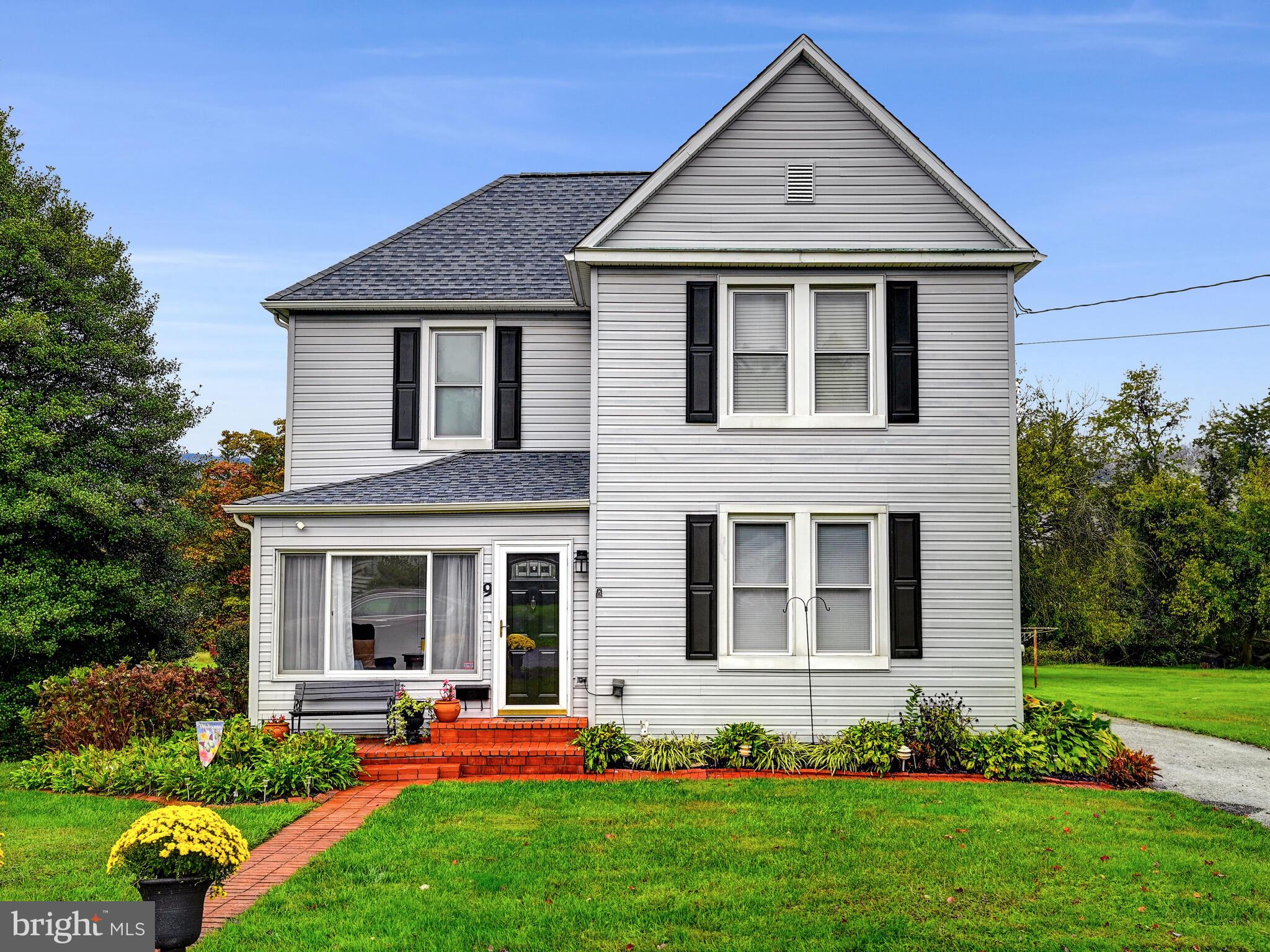 Welcome to 9 Wolf Avenue in the heart of Reisterstown!  You are sure to fall in love with this Move-In Ready home that has been extremely well maintained and renovated by the long-time owners. Located just a few blocks from the I-795 & Rt 140 interchange as well as being walking distance to Main Street Reisterstown, this home is perfectly tucked away yet extremely accessible to the surrounding area.  No stone has been left unturned with this home in terms of maintenance or updating. The most recent and notable renovations are the Fully Renovated Kitchen and both Full Bathrooms along with fresh paint throughout.  As you enter the front door you are greeted by the lovely front Sun Room - a cozy place to relax - that leads to your Foyer with the formal Living Room off to the right. The separate Living and Dining Rooms are connected yet provide two separate spaces and are accented by the faux fireplace on each side.  Original hardwood floors gleam in these two rooms along with the entire upper floor of the home! Walk through to the brand-new Renovated Kitchen featuring custom wood shaker cabinetry, calacutta quartz countertops and stainless steel appliances all accented by the gleaming white subway tile backsplash and under-cabinet accent lighting. The pantry offers plenty of space for food storage as well. Relax and unwind in the heart of the home - the large Family Room - that features a wood stove and provides direct access to the Rear Deck and large Backyard.  Additionally found off of the Family Room are the Laundry Room, Main Level Bedroom and a Full Bathroom with custom tiled walk-in Shower.  Wander upstairs to find 3 Bedrooms and another Full Bathroom with a Tub and tiled surround. The Rear Decks provide ample space for entertaining and BBQ’s along with a concrete pad that has power access and another deck for a Hot Tub! Recently stained, the multi-tiered deck offers many options for outdoor living.  The driveway boasts room for 5-6 vehicles along with the 2 Car Detached Garage.  The lush Rear Yard could be fenced in easily to make this a private oasis!  This home is a true winner and offers so much for the next owners to call this house a home.  Don’t wait on this one - Schedule a showing today!