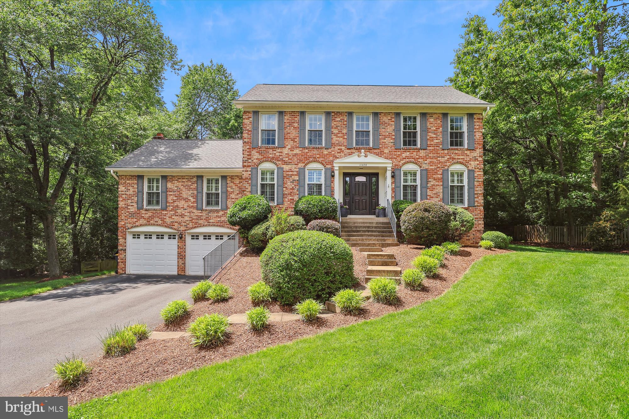 Welcome to 11476 Bronzedale Drive in desirable Waples Mill Estates. Prepare to be captivated by the casual elegance and charm of this inviting residence.  Considered the crown jewel of the neighborhood, this property boasts exceptional curb appeal, featuring a long driveway and beautifully landscaped grounds leading to a stately four-sided brick Colonial that is perfectly sited on a gorgeous .87-acre lot.  Every detail of this home has been thoughtfully customized with high-quality, on-trend renovations, creating smart spaces that are ideal for both everyday living and entertaining.  Step inside through the covered portico with paneled walls and an impressive front door into a welcoming foyer.  To either side of the foyer, you'll find a spacious dining room, perfect for hosting large gatherings, and a private library, offering an excellent work-from-home environment.  The great room is truly spectacular featuring soaring vaulted and beamed ceilings, a cozy wood-burning fireplace, custom built-in shelving, a charming bay window, and double glass doors that open to the expansive deck. The renovated gourmet kitchen is a chef's delight, equipped with high-end appliances, abundant counter space, custom cabinetry, a large center island with seating, and a bay window to enjoy views of nature while dining.  Offering approximately 4,000 square feet of well-designed living space, this 5-bedroom, 3.5-bathroom home lives large and is filled with incredible natural light and picturesque views from every room.  The bedroom level offers a luxurious primary suite complete with a spa-like bathroom, along with three additional generously sized bedrooms and a renovated hall bath.  The lower level provides endless possibilities, featuring an in-law suite with a renovated bathroom, and enormous flex space that is currently utilized as a home gym and playroom.   The exterior of the home is equally as impressive, with an expansive Trex deck with a pergola for shade and a flagstone patio, perfect for enjoying the outdoors. The level backyard is exceptional, providing plenty of space for play, pets or a pool.  This home has been meticulously maintained and fully customized with numerous thoughtful touches, creating an organized home that is ideal for making memories with family and friends. Important updates include:  HVAC (2023), Lower Level Full Renovation (2022), Deck, Flagstone Patio, Gutter Helmets (2020), Roof (2019), Upper Level Full Renovation (2018),  Main Level Renovation - Gourmet Kitchen, Great Room Built-ins, Ceiling, Laundry Room, Powder Room, Sand in Place Hardwoods (2015).  Schools are in the highly sought after Oakton High School pyramid, and Waples Mill Elementary is within walking distance.  Perfectly located with easy access to major commuter routes - 50, 66 and 267, the Silver Line Metro, Inova Hospital and Dulles Airport. Minutes to shopping and restaurants at Reston Town Center, Fairfax Corner and Tysons. Just a short stroll to the Oakton Swim and Racquet Club (membership required) with swimming, tennis and pickleball.