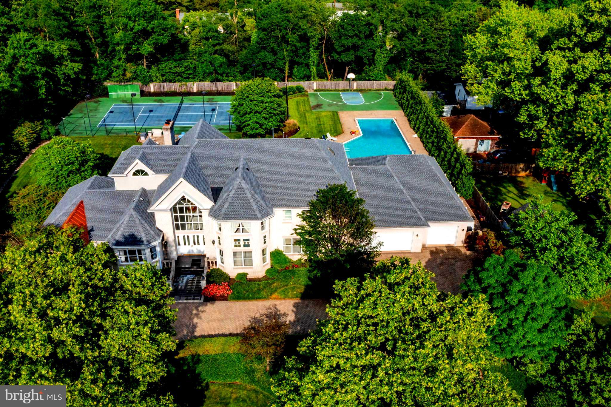 Welcome to 6239 Medora Rd 
This magnificent estate, though it carries the charm of its era, stands as a testament to classic luxury and timeless design. The sprawling property features a grand mansion with distinct architectural elements, reflecting the opulence and style of its time.
The estate is enveloped by lush, mature trees and well-kept gardens, offering a serene and picturesque environment. Complete with Lighted Tennis Court for sports enthusiasts. 
 A large, inviting swimming pool sits adjacent to the house, surrounded by a meticulously landscaped lawn and attached pool house with awning.  Ideal for relaxation and outdoor entertainment, the pool area also includes a poolside patio space for lounging. A full sports court sits next to the pool for the kids to play all day. The pool house is all you need to entertain with its own kitchen and appliance’s. The pool house features changing rooms with showers and bathrooms.
When entering the home you are greeted by a complete open floor plan that has stood the test of time. With a large home office just off the front door. Someone that works from home would adore! 
This 6 bedroom 10 bathroom home has so much to offer. Some of the most recent updates include a COMPLETE NEW ROOF put on in 2023. NEW HVAC SYSTEMS and HOT WATER HEATER 2023
Ample garage space is available, ensuring plenty of room for vehicles and storage. Plenty of room for guest car’s with a wrap around driveway. 
 Potential features to upgrade include spacious room for  a gourmet kitchen, formal dining room, multiple 6 bedrooms with en-suite bathrooms are ready to be taken to the next level.  
Expect custom details such as hardwood flooring, crown molding, fireplaces, and built-in cabinetry, reflecting the home's high-end status.
The fully finished basement features a full wet-bar, Sauna, fireplace. With even more storage space and full laundry room with a large cedar room/ closet  to store clothing.
Medora's basement  features a home gym in the basement and extra bedroom for guests.
Get on all  major commuter route’s  including 95,695,295 within 5 min or less.  Close to Baltimore City, Washington DC and Annapolis  Close to Light Rail and Marc trains make for an even easier  commute! Get to BWI in Minutes!!
This estate is a haven for luxury and recreation, perfectly blending sophisticated living spaces with extensive outdoor amenities. It caters to a lifestyle of comfort, leisure, and grandeur, making it an ideal residence for those who appreciate fine living and private, spacious environments. Come and put your finishing touches on this one of a kind home in Linthicum MD.