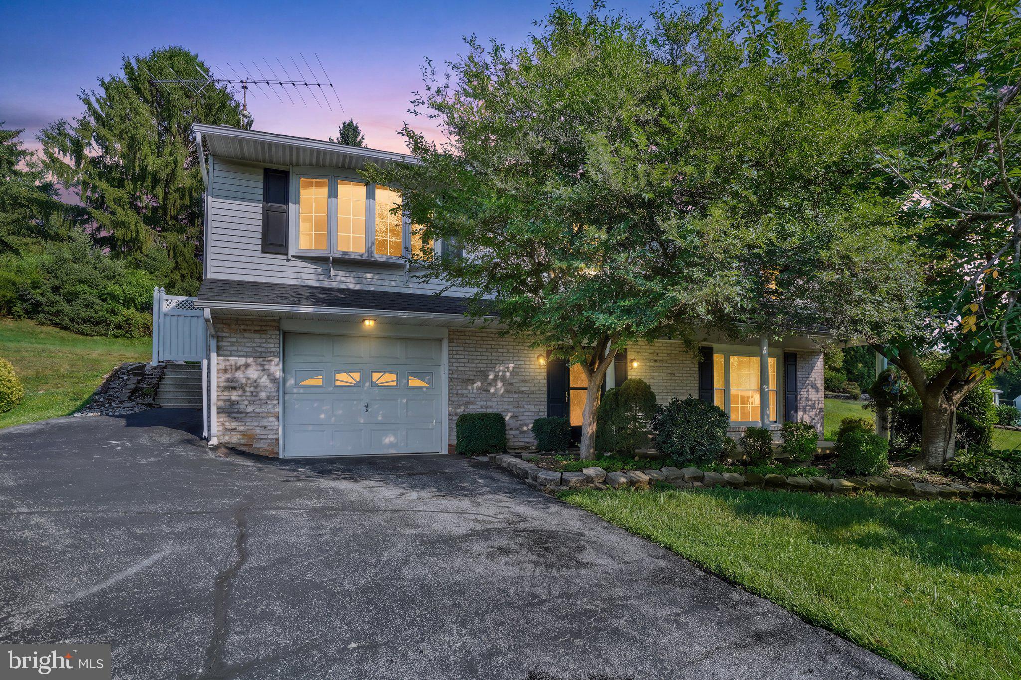 Introducing 127 Strassburg Circle, in the ideally located Southern Farms community, which is adjacent to shopping areas, dining options and parkland, and just moments to I-83 exit 4, New Freedom attractions, and the PA/MD Line! This lovingly maintained home offers 4 beds and 2 baths, a spacious open layout and a lovely 0.62 acre lot with a tastefully landscaped backyard, an in-ground pool, built-in garage and plenty of parking. The generous open living room flows smoothly into the dining room and adjacent kitchen, with sliders leading to the fenced pool and patio area for an easy transition between indoor and outdoor entertaining spaces. 3 comfortable main level bedrooms are served by a generous full bath, while the entry level offers a 4th bedroom with adjacent full bath and a family room with brick corner fireplace and wood stove insert, providing additional gathering space for both everyday enjoyment and special occasions. Just add your personal touch and a few cosmetic updates to make it sparkle!