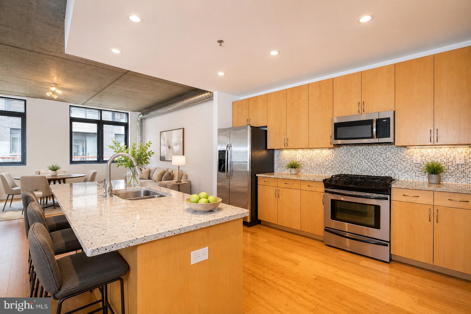 Modern Bi-Level Loft Condo with Deeded Parking in the Heart of Center City

Experience nearly 1,500 square feet of distinctive loft living in this exceptional bi-level residence, ideally located on picturesque Kater Street in the heart of Center City Philadelphia.

Designed with both style and functionality in mind, this one-of-a-kind home showcases soaring concrete ceilings, exposed architectural details, oversized windows, warm bamboo flooring, and expansive open living spaces rarely found in Center City condominiums. The flexible bi-level layout creates a natural separation between entertaining, working, and relaxing, making it equally well suited for everyday living or working from home.

The spacious open-concept kitchen anchors the main level and flows seamlessly into the dining and living areas, creating an ideal space for entertaining. Generous cabinetry, abundant counter space, and dramatic loft architecture combine to create a home that feels both modern and inviting.

The lower level offers exceptional flexibility with a large private bonus space featuring two oversized closets. Whether used as a home office, media room, fitness studio, guest lounge, creative workspace, or additional living area, this adaptable space easily evolves with your lifestyle.

A unique feature of the home is the option to enter directly from your own private Kater Street entrance or through the building's lobby. This dual-access design offers the convenience of condominium living with the flexibility of a private street-level entrance when desired.

A separately deeded garage parking space provides exceptional value and flexibility. Keep it for everyday convenience, lease it for supplemental income, or sell it separately in the future.

Located just steps from Philadelphia's renowned restaurants, neighborhood cafés, boutique shopping, parks, and cultural attractions, this home offers the perfect balance of vibrant city living and private retreat.

This is a rare opportunity to own a spacious, architecturally distinctive loft in one of Center City's most desirable neighborhoods.

Schedule your private showing today.