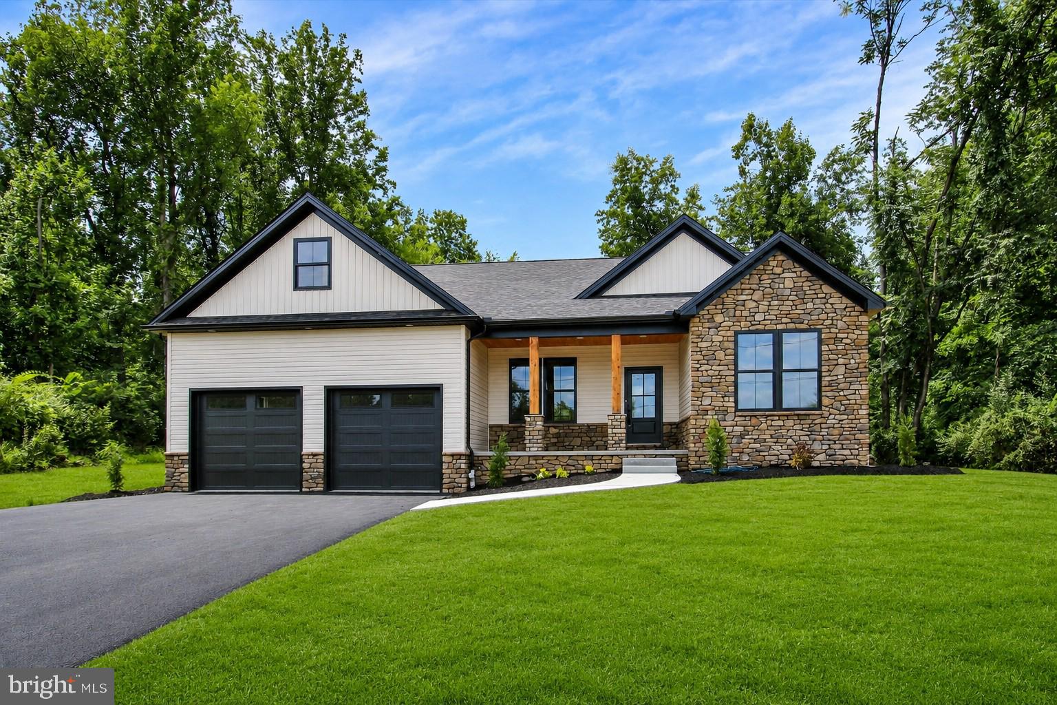 Nestled in the serene enclave of Fairfield/Carroll Valley, this exquisite new construction home, completed in 2026, embodies the perfect blend of modern luxury and timeless comfort. Designed in a charming Ranch/Rambler style, this detached residence offers an inviting atmosphere that feels like home from the moment you step inside. Spanning over a generous 0.52-acre lot, the property features a thoughtfully designed layout with three spacious bedrooms and two and a half elegantly appointed bathrooms. The heart of the home is undoubtedly the gourmet kitchen, equipped with high-end stainless steel appliances, including a built-in microwave, self-cleaning oven, electric range, and a sleek refrigerator. The open-concept design seamlessly connects the kitchen to the living and dining areas, making it ideal for both entertaining and everyday living. Luxury vinyl plank flooring flows throughout the home, providing both durability and a warm aesthetic that complements any decor. The exterior of the home is equally impressive, featuring a combination of stick-built construction, stone accents, and vinyl siding that not only enhances curb appeal but also ensures longevity and low maintenance. The oversized front-entry garage provides ample space for vehicles and storage, while off-street parking adds convenience for guests. Enjoy the tranquility of your surroundings from the comfort of your new home, where every detail has been meticulously crafted to enhance your lifestyle. With no pool to maintain, you can spend your weekends exploring the beautiful landscapes of Carroll Valley or simply relaxing in your spacious backyard. This property is not just a house; it's a lifestyle choice that offers the perfect balance of luxury, comfort, and convenience. Experience the joy of living in a brand-new home that reflects your aspirations and provides a sanctuary for years to come. Embrace the opportunity to make this stunning residence your own and enjoy the exclusive lifestyle it offers.