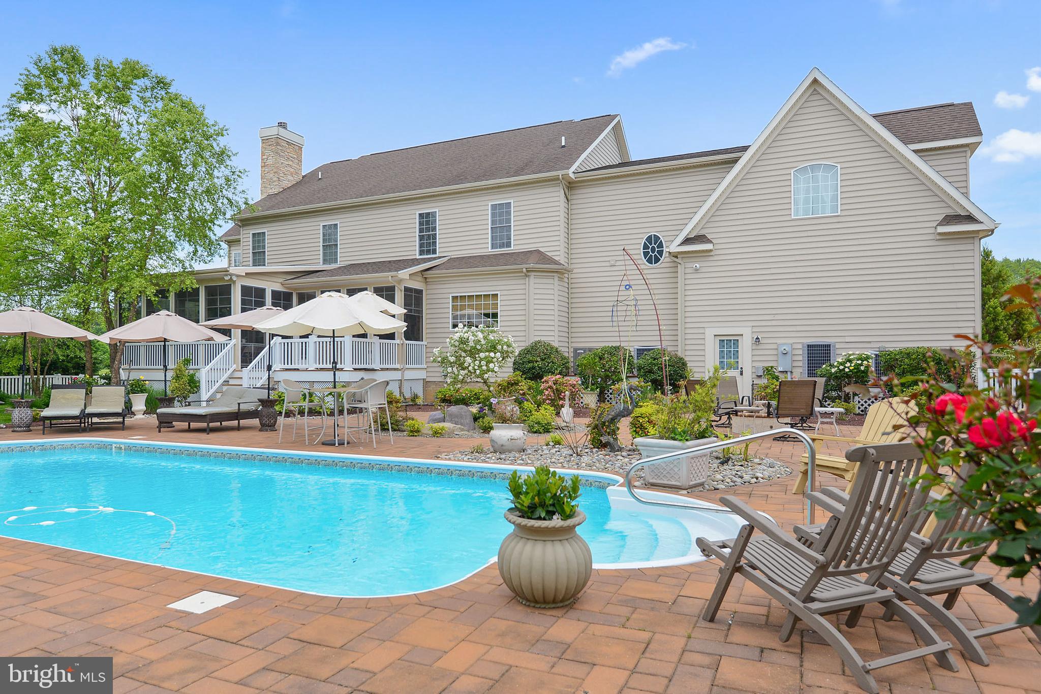 This incredible six-bedroom estate is on seven plus acres with a fabulous pool and magnificent pool house, has privacy but is in a community close to all that Ocean City has to offer!  With work and school being conducted remotely, now's the time to take advantage of this opportunity to own what is, in effect, your own personal high end luxury resort.  You and your family will never want to leave! This estate is in the exclusive neighborhood of Indian Creek on 7.77 magnificent acres with its own private pond, a beautiful oversize salt water pool and luxurious pool house.  This sensational 6332 sq ft home is minutes from Assateague Island and Ocean City in one of the Eastern Shore's finest vacation destinations. The property features exceptional craftsmanship with astute attention to detail. This home is built for family living and has custom finishes inside and a private oasis outside. The home offers 6 bedrooms, 5 full baths and 2 half baths.  Outside there is a huge in ground pool, beautifully landscaped custom paver patio, a gazebo, and a fully finished pool house with its own kitchenette, workout lounge, full bath and a large office or guest suite on the 2nd floor.  The back yard is fully fenced and offers views of the pond. Inside the home you will find a fabulous gourmet kitchen with eat in dining area, a wet bar, wine cooler, a center island and Corian countertops, all of which will surely delight the chef in your family.  Off the kitchen is a spacious great room with a wood burning fireplace for year-round enjoyment and perfect for entertaining family and friends. Not to be missed is the three-season sunroom with screened in porch off the kitchen which overlooks the pool and beautifully landscaped grounds. There is a formal living area and study with fireplace on the first floor as well.  On the second level you will find the luxurious master suite complete with a sitting area and a master bath retreat.  The additional bedrooms and bath are all large in size making this the perfect home for your family.  Additional features in this estate home include: 3 car garage, hardwood floors, custom tile floors, crown moldings, tray ceilings, built-ins, custom cabinetry, hardwood floors, custom window treatments and 4 zone high efficiency heat pump system. There is also custom lighting throughout the home, attic storage, and the list goes on and on. This estate home is 1.5 miles from Ocean City Golf Course, 1.5 miles from the Public Boat Ramp, 2.4 miles from Rum Point Golf Course, 6 miles from Assateague Beach, 8.5 miles from Ocean City Airport, 9.4 miles from Sunset Marina and 10.5 miles from the Ocean City Boardwalk. Your family and friends are sure to make memories that last a lifetime here.  Come see for yourself.  Schedule you're showing today and consider making this dream home yours!