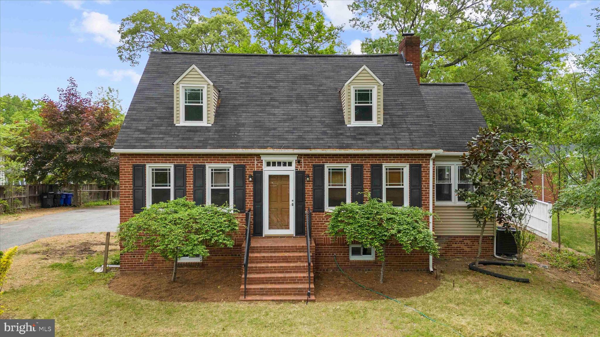 Welcome home to this beautifully updated Cape Cod offering 3 bedrooms, 2 full bathrooms, and the perfect blend of classic charm and modern improvements. Inside, you'll find refinished hardwood floors, fresh paint, new carpet, elegant crown molding, updated lighting, and upgraded electrical throughout the main and upper levels. The kitchen shines with granite countertops, stainless steel appliances, a new sink, and a warm, inviting feel that makes everyday living easy. A bright sunroom with new flooring and replacement windows adds even more flexibility—perfect for a home office, reading nook, playroom, or cozy sitting area. The bathrooms have been refreshed with new flooring, plumbing has been updated, and a beautiful picture window in the primary bedroom brings in abundant natural light. Beyond the cosmetic updates, this home offers valuable peace of mind with a new HVAC system backed by a 10-year limited warranty, a new water heater with warranty coverage, and a transferable home warranty. Step outside to a huge back deck overlooking a flat, fully fenced backyard with plenty of room for entertaining, pets, play, gardening, or creating your dream outdoor retreat. The exterior has been thoughtfully improved with dead tree removal, lawn regrading and seeding, ivy treatment around tree bases, new front landscape borders, and a freshly pressure-washed exterior and roof. Enjoy evenings around the custom paver and gravel fire pit area, while the repaired and freshly painted deck and railings provide the perfect space for gatherings!