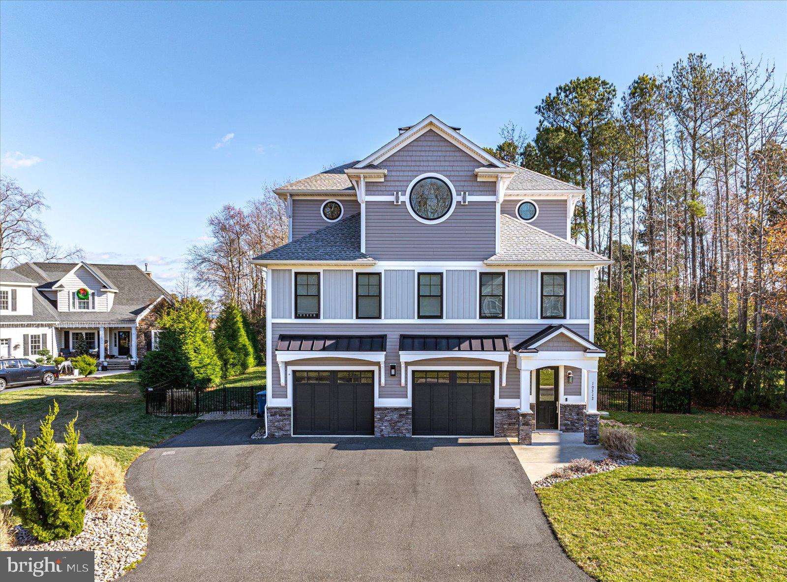 Welcome to 10321 Plantation Ln! This stunning three-level home was constructed in 2020 and is located in the desirable Bay Point Plantation neighborhood. Enter the ground floor to find an oversized two-car garage, ground-floor living area that opens out to the patio and pool, in addition to a guest bedroom and full bath. As you proceed upstairs, you'll find the main living area, with a large open living space, dining and kitchen. Natural light pours into the room through large windows and a slider leading out to a large second-story balcony, providing views over the pool and out over Turville Creek. The gourmet kitchen features all stainless steel Viking appliances, custom cabinetry, a built-in coffee bar with additional storage and an expansive island with enough seating for everyone! A large pantry also provides plenty of storage space. Also on this level is a powder room, two additional bedrooms and a full bath. As you make your way upstairs to the third floor, you'll find another bedroom and the lovely master suite. This master suite contains a beautiful master bathroom, complete with an oversized, dual head tile shower, double vanity and soaking tub. Through the master bath, you will also find a giant custom walk-in closet. The master suite is equipped with sliders leading out to a private balcony - the perfect place to escape and enjoy with views out over the water. This home features a fenced in yard and a large patio, with outdoor entertaining space, pool and hot tub - all inside a gated community providing privacy and tranquility. Why wait to build when your dream home already awaits? Schedule your appointment to see it today before it's gone!