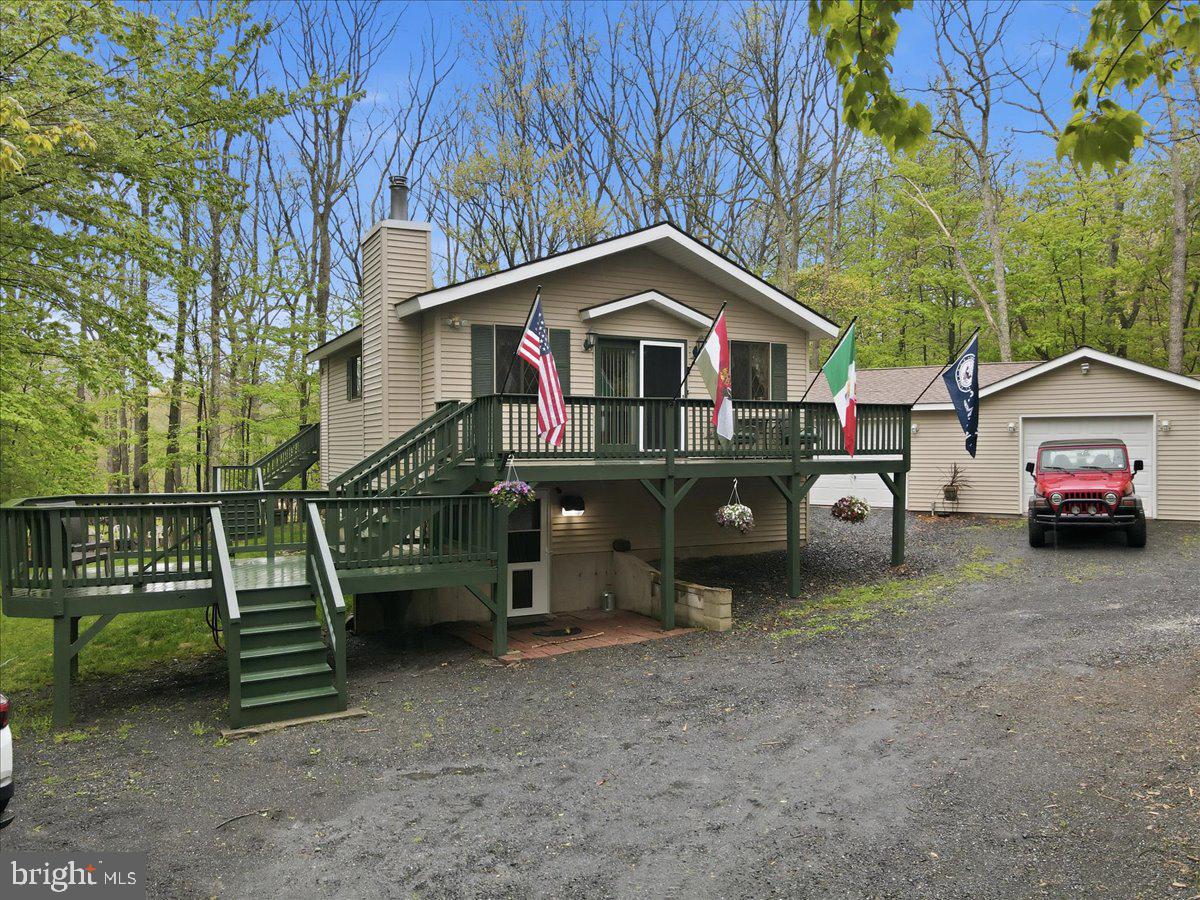 Enjoy the best of peaceful country living with easy access to nearby conveniences in this 3-bedroom home featuring a large family room, 2 bathrooms, an eat-in kitchen, and a detached garage with additional storage, all situated on more than an acre just minutes from Effort Mountain. Surrounded by wooded areas with plenty of privacy, this property offers a quiet retreat with ample space for outdoor activities, gardening, or simply relaxing on one of the two large decks. Inside, the home is filled with plenty of natural light and features a cozy wood stove, creating a warm and inviting atmosphere year-round. Additional garage and storage buildings provide excellent space for vehicles, tools, and hobbies. The home is also wired for a generator, with the generator.