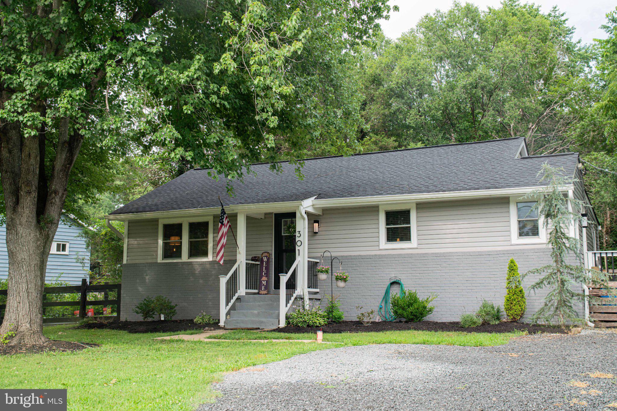 Welcome home! This adorable bungalow has been completely remodeled from top to bottom in 2023 and is truly move-in ready. Major updates include a spotless crawl space with a brand-new vapor barrier and dehumidifier, offering peace of mind for years to come.

The home was taken down to the studs and thoughtfully redesigned to include a convenient half bath and a spacious laundry room featuring built-in cabinetry, a new Samsung washer and dryer, and a 50-gallon water heater.

The designer kitchen is sure to impress with quartz countertops, brand-new Samsung stainless steel appliances, a built-in microwave, full tile backsplash, recessed lighting, luxury vinyl plank flooring, a deep sink, and stylish matte black fixtures.

Natural light pours through the oversized sliding glass door, which opens to a flat backyard and a brand-new deck completed in 2025. In the evenings, relax by the stunning 60-inch electric fireplace, creating the perfect atmosphere for entertaining guests or enjoying a quiet night at home.

Additional updates include a beautifully renovated full bath with all new fixtures, all-new windows, new interior and exterior doors, fresh front-yard landscaping with new sod, and a freshly graveled driveway.

This charming, fully updated home combines modern style, comfort, and functionality—just unpack and enjoy!