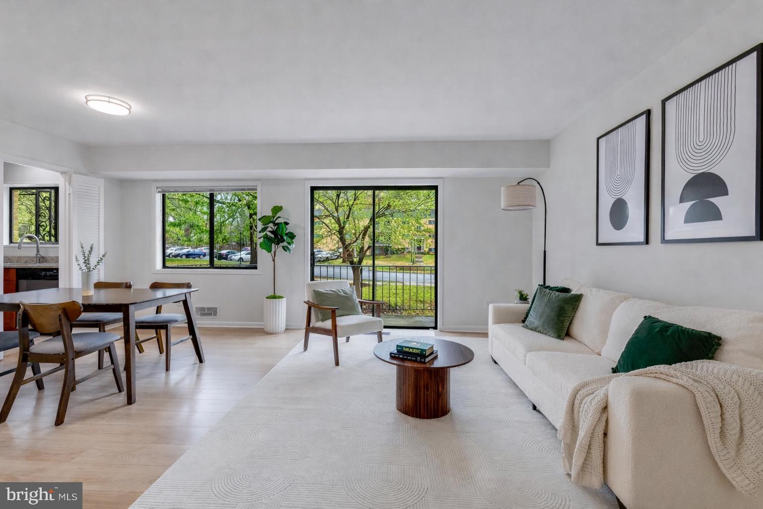 *NEW PRICE! OPEN SUNDAY, 5/17, 2-4PM* Some homes invite you to slow down the moment you arrive, and this one does exactly that. Nestled in the quietest corner of a vibrant Bethesda community, this beautifully updated 2-bedroom, 1-bathroom condo is a rare find: a charming, sun-drenched retreat that feels worlds away from the bustle, yet puts you within arm's reach of everything that makes Bethesda one of the most coveted addresses in the DMV.

Step inside and the warmth hits you immediately. Wide-plank oak LVP flooring flows through 1,064 square feet of thoughtfully designed living space, catching the light that pours through generous windows at every turn. The kitchen is sleek and functional, with granite countertops, stainless steel appliances, and a large window that makes even a Tuesday morning feel a little brighter. The open living and dining area connects to a private balcony through sliding glass doors, your own quiet perch to sip coffee, read, or simply exhale after a long day.

Two generously sized bedrooms offer the kind of storage you will actually use, including a spacious primary with two closets. The reimagined bathroom is all clean lines and contemporary finishes, with a sleek modern vanity and updated lighting that gives the space a decidedly fresh feel.

The value here is hard to beat. The monthly condo fee covers all utilities, including electric, gas, water, heat, and air conditioning, so your monthly costs stay predictable and simple. A storage unit conveys, parking passes are included, and on-site laundry is located within the building.

Then there is the community itself. Take a dip in the pool, rally on the tennis courts, or gather at one of two clubhouses. A playground rounds out the amenities, making this a neighborhood that genuinely delivers on lifestyle.

And the location quietly overachieves. Less than a mile from the Capital Beltway, the Grosvenor Metro station, and the Garrett Park MARC station, your commute practically plans itself. A Route 6 bus stop sits right out front for car-free access to Metro and Westfield Montgomery Mall. Rock Creek Park is just steps away for weekend trail runs and evening walks, and the world-class Strathmore Music Center is practically a neighbor.

Peaceful, polished, and perfectly positioned. This is Bethesda living at its most effortless, and it is ready for you to call it home.