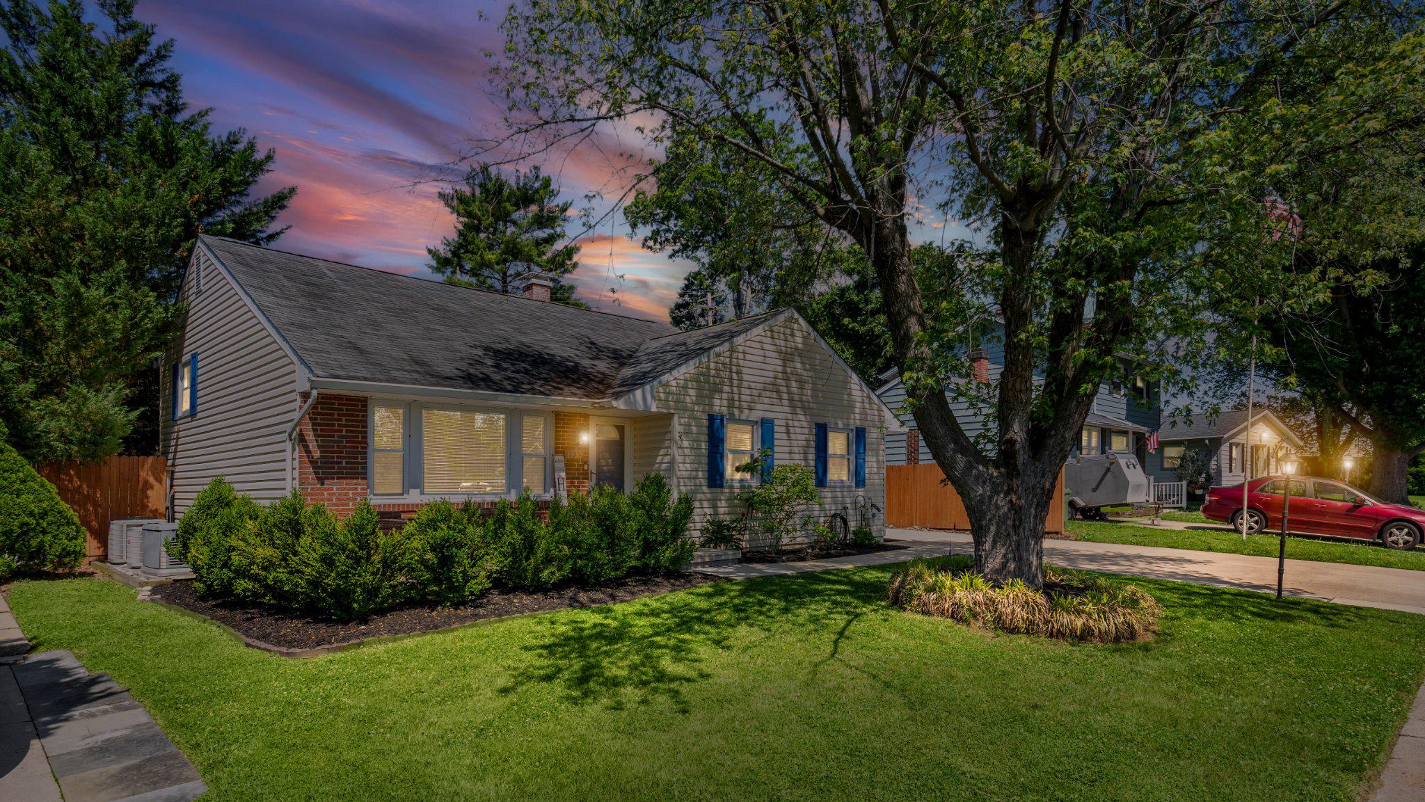Beautifully updated and impeccably maintained, this move-in ready single-family home combines timeless charm, functional living space, and exceptional pride of ownership throughout. Featuring a classic brick and vinyl exterior, a welcoming front porch, and attractive curb appeal, this home is sure to impress.

Step inside to a bright and inviting family room highlighted by soaring vaulted ceilings, beautiful hardwood flooring, a custom built-in entertainment center, and a cozy fireplace. The updated gourmet eat-in kitchen offers granite countertops, 42-inch white cabinetry with crown molding, a stylish subway tile backsplash, stainless steel appliances, and ample table space for everyday dining.

The upper level features three spacious bedrooms, each accented by gleaming hardwood floors, along with a beautifully updated full bathroom. The lower level expands your living space with a comfortable rec room featuring durable LVP flooring, recessed lighting, elegant tray ceilings, and a second fireplace, creating the perfect setting for relaxing or entertaining. An updated full bathroom adds flexibility for guests and everyday living, while the utility room offers front-load laundry, a utility sink, and walk-up access to the rear yard.

Outdoor living is equally impressive with a fully fenced backyard, extended off-street parking, and an oversized detached garage offering exceptional storage and workshop potential. Additional highlights include zoned heating and air conditioning and a generator for added peace of mind. Meticulously cared for and tastefully updated throughout, this home is truly move-in ready. Enjoy the convenience of nearby goods and services, dining, shopping, and major commuter routes.