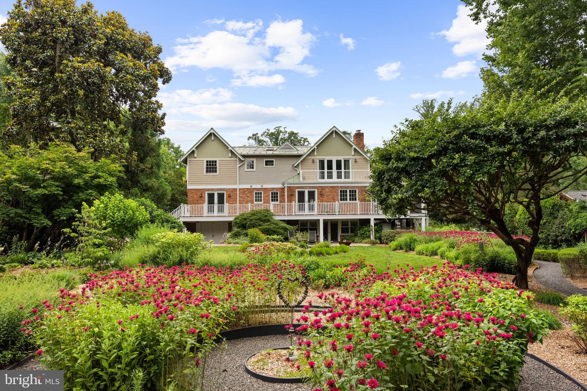 <p>A Private Sanctuary Like No Other in Falls Church City’s sought-after Broadmont. Inspired by Nature, Designed for Living.</p>

<p>If the idea of living fully integrated with nature in an eco-conscious home, surrounded by an organic, carefully planned landscape appeals you, this could be your 1 of 1!</p> 
<p>2007 full remodel surrounded by masterfully designed gardens on almost half an acre. Natural light and garden vistas abound in the well-planned interior, centered on bringing nature indoors.</p>

<p>Upper-level Primary Suite wing with Private Balcony (overlooking rear gardens, framed in tapestry of mature trees) two walk-in closets and gas fireplace.  Sky-lit en-suite with dual vanities, steam shower and private WC, all in calming natural tones.</p>

<p>Main-Level dual office/ in-law or guest suite. Screened-in Porch off Kitchen connects to full width rear deck with access to Dining Room and back office/bedroom, all with their own views of the gardens.</p>
 
<p>Lower-Level cozy Rec Room with 3rd Fireplace and view of gardens, French doors for easy indoor/ outdoor entertaining, also doubles as additional guest suite with built-in Murphy bed and full bath w soaking tub.</p>

<p>Plentiful well-organized storage options throughout, including closets, easily accessed attic spaces, dedicated lower-level storage room and full-length former rear-load garage.</p>

<p>Designed and cared for to exacting standards and eco-conscious methods in all respects.</p>

<p>For more detailed information, see document section.</p>