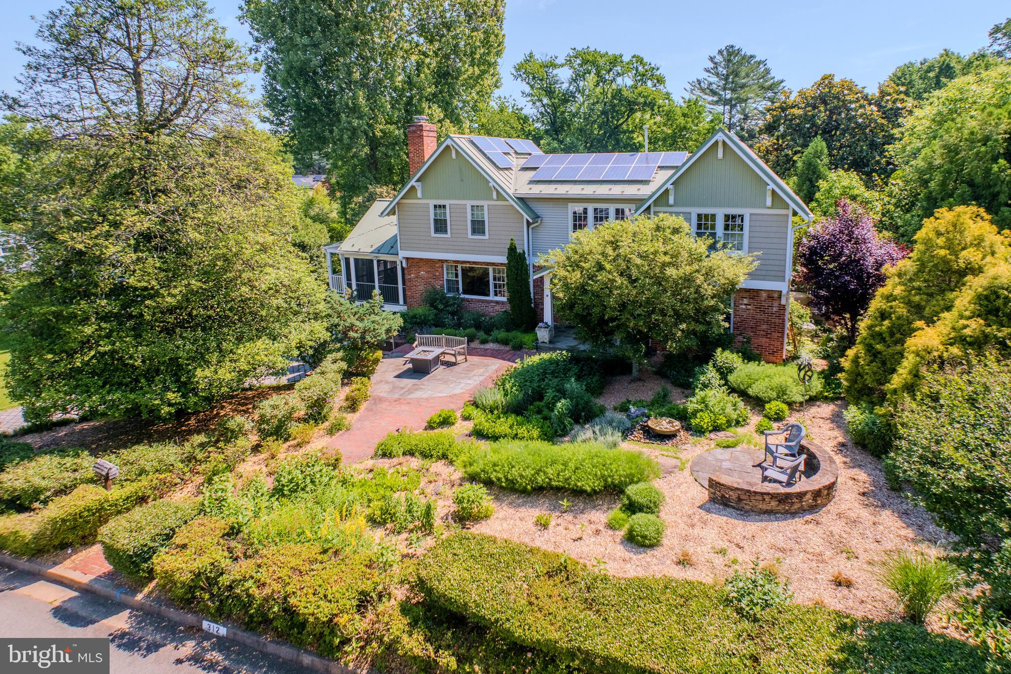 <p>A Private Sanctuary Like No Other in Falls Church City’s sought-after Broadmont. Inspired by Nature, Designed for Living.</p>

<p>If the idea of living fully integrated with nature in an eco-conscious home, surrounded by an organic, carefully planned landscape appeals you, this could be your 1 of 1!</p> 
<p>2007 full remodel surrounded by masterfully designed gardens on almost half an acre. Natural light and garden vistas abound in the well-planned interior, centered on bringing nature indoors.</p>

<p>Upper-level Primary Suite wing with Private Balcony (overlooking rear gardens, framed in tapestry of mature trees) two walk-in closets and gas fireplace.  Sky-lit en-suite with dual vanities, steam shower and private WC, all in calming natural tones.</p>

<p>Main-Level dual office/ in-law or guest suite. Screened-in Porch off Kitchen connects to full width rear deck with access to Dining Room and back office/bedroom, all with their own views of the gardens.</p>
 
<p>Lower-Level cozy Rec Room with 3rd Fireplace and view of gardens, French doors for easy indoor/ outdoor entertaining, also doubles as additional guest suite with built-in Murphy bed and full bath w soaking tub.</p>

<p>Plentiful well-organized storage options throughout, including closets, easily accessed attic spaces, dedicated lower-level storage room and full-length former rear-load garage.</p>

<p>Designed and cared for to exacting standards and eco-conscious methods in all respects.</p>

<p>For more detailed information, see document section.</p>