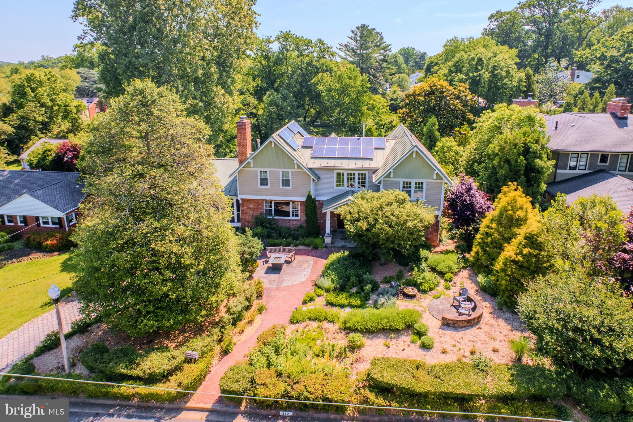 <p>A Private Sanctuary Like No Other in Falls Church City’s sought-after Broadmont. Inspired by Nature, Designed for Living.</p>

<p>If the idea of living fully integrated with nature in an eco-conscious home, surrounded by an organic, carefully planned landscape appeals you, this could be your 1 of 1!</p> 
<p>2007 full remodel surrounded by masterfully designed gardens on almost half an acre. Natural light and garden vistas abound in the well-planned interior, centered on bringing nature indoors.</p>

<p>Upper-level Primary Suite wing with Private Balcony (overlooking rear gardens, framed in tapestry of mature trees) two walk-in closets and gas fireplace.  Sky-lit en-suite with dual vanities, steam shower and private WC, all in calming natural tones.</p>

<p>Main-Level dual office/ in-law or guest suite. Screened-in Porch off Kitchen connects to full width rear deck with access to Dining Room and back office/bedroom, all with their own views of the gardens.</p>
 
<p>Lower-Level cozy Rec Room with 3rd Fireplace and view of gardens, French doors for easy indoor/ outdoor entertaining, also doubles as additional guest suite with built-in Murphy bed and full bath w soaking tub.</p>

<p>Plentiful well-organized storage options throughout, including closets, easily accessed attic spaces, dedicated lower-level storage room and full-length former rear-load garage.</p>

<p>Designed and cared for to exacting standards and eco-conscious methods in all respects.</p>

<p>For more detailed information, see document section.</p>