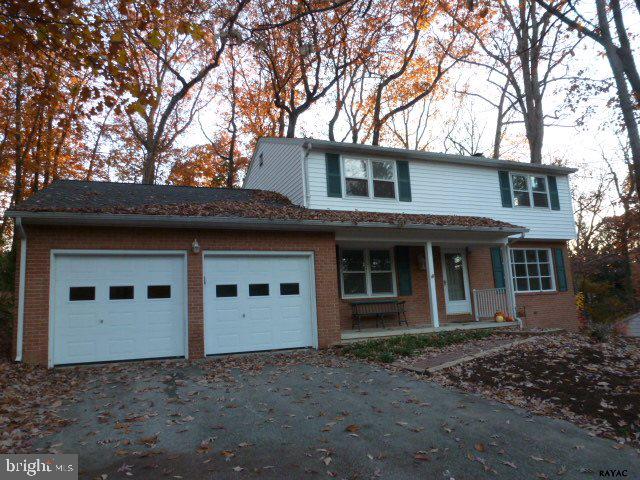 Lovely Colonial in desirable location on a beautiful wooded lot with mature landscaping. This home boasts hardwood floors, fresh paint & new lighting fixtures throughout. Completely remodeled bathrooms. Bright kitchen features light maple cabinetry, Corian countertops, breakfast nook & new floor covering.  Wood burning fireplace w/gas log insert. Sunroom. Hurry!