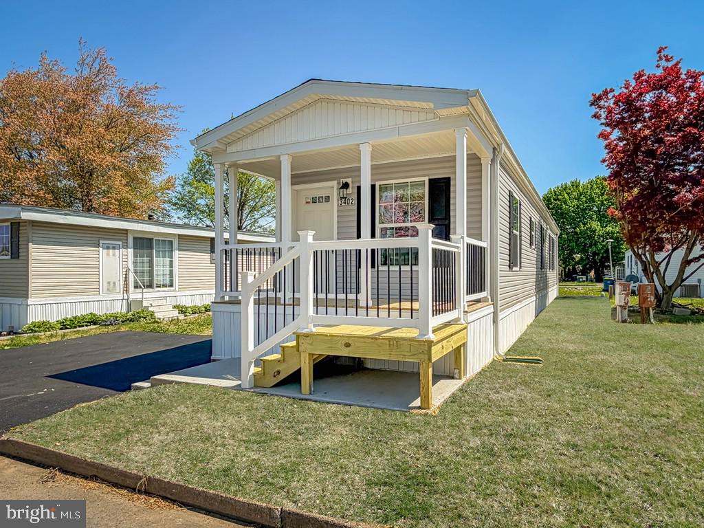 Relax and enjoy those warm summer nights on your front covered porch. The open concept 2-bedroom 2 bath home has everything. The main bedroom has a large closet and a master bath with a walk-in shower and double vanity. All LED lighting and crown molding throughout the home and will come with an 8 x 8 matching shed.