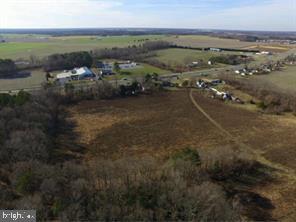 Situated at the crossroads of convenience, this exceptional 25 +/- acre property for sale near the DE Turf Sports Complex boasts an enviable entrance off DE 1 and Milford Neck Rd. This strategic location offers excellent visibility, accessibility, and a gateway to a host of possibilities. Seize this incredible opportunity to leverage the advantages of the BG zoning and shape this property into a remarkable showcase of innovation and growth. Explore the limitless potential within this property's boundaries and envision a future that capitalizes on its strategic location, convenient entrances, and versatile zoning. Enquire now to embark on an exciting journey of real estate development and investment. Owner financing to qualified buyers.