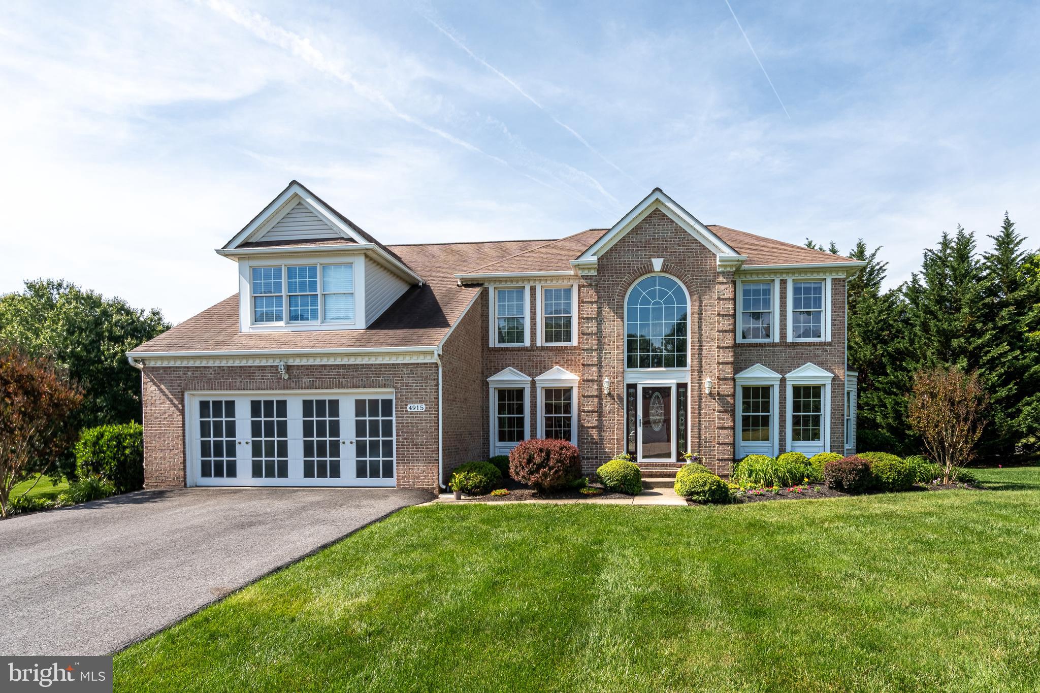 Absolutely stunning home situated on a beautifully landscaped 1-acre lot, designed for both everyday living and exceptional entertaining. Features include hardwood floors, a spacious kitchen with center island, granite countertops, and updated appliances (2023–2025), a four-season sunroom, main-level library, and inviting family room. The expansive primary suite offers sitting and dressing areas, three walk-in closets, and a beautifully renovated luxury bath (2019) with soaking tub and separate shower.

The fully finished walkout lower level boasts a large recreation room, wet bar, and full bath. Outdoor amenities include a heated in-ground pool, hot tub, deck, patio, and professionally enhanced pool landscaping (2024), creating a private backyard retreat.

Major updates include a new roof (2018), entry door, storm door and sidelights (2022), asphalt driveway (2022), pool pump and heater (2022), pool tile (2019), reverse osmosis water filtration system (2023), and garage door opener (2026). A truly exceptional property offering luxury, comfort, and peace of mind.