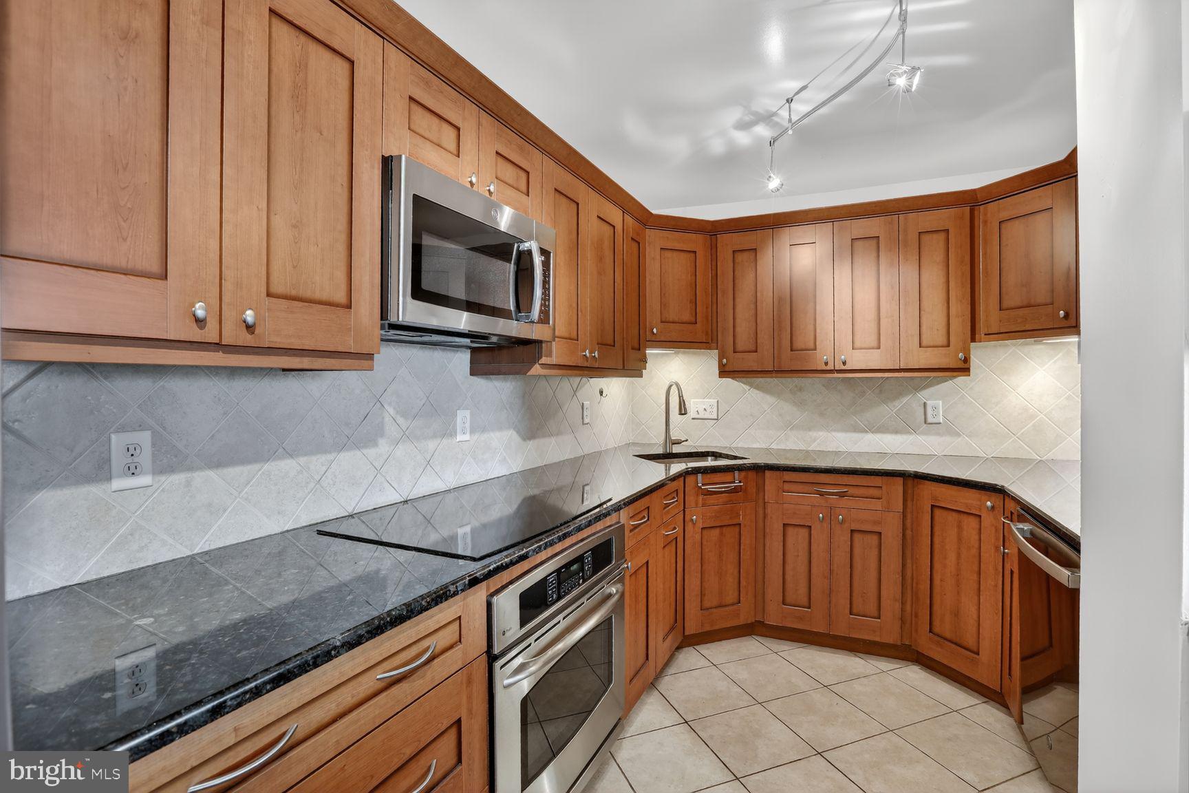 Welcome to 1101 Saint Paul Street #412, a spacious 2-bedroom, 2-bath condominium located on the northern edge of Baltimore's historic Mount Vernon neighborhood. Offering over 1,300 square feet of living space, this unit combines comfort, convenience, and an unbeatable location.

Inside, you'll find hardwood flooring throughout the main living areas.  The open floor plan provides generous living and dining spaces, while the kitchen features granite countertops, stainless steel appliances, a newer dishwasher and newer garbage disposal.  

The spacious primary suite features a large walk-in closet with custom built-in organizers and a private bathroom with a jetted tub. The second bedroom also includes a custom closet system and the full hallway bathroom offers a walk-in shower.

Additional features include smart thermostat, a washer and dryer hookup within the unit.   A new hot water heater was installed in 2025.

This professionally managed building offers outstanding amenities.   Residents also enjoy the convenience of an on-site pizzeria/takeout options and convenience store located within the building. Parking options include on-street parking or the ability to rent a garage space within the building. Guests can even take advantage of valet parking services.

The location is exceptional. Walk to Mount Vernon attractions including The Walters Art Museum, Meyerhoff Symphony Hall, Penn Station, local restaurants, coffee shops, and neighborhood favorites. The Belvedere and The Owl Bar are located just half a block away. Major commuter routes, including I-83, are easily accessible for travel throughout Baltimore and beyond.

Don't miss your opportunity to own this spacious condo in one of Baltimore's most historic and vibrant neighborhoods. Schedule your tour today!