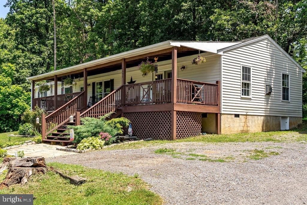 Enjoy the perfect blend of comfort, space, and value with this charming home just outside of Grottoes! Situated on a beautiful 1-acrelot, this well-maintained property offers 3 bedrooms, 2 full baths, and approximately 1,600 square feet of comfortable living space. Inside, you'llappreciate the brand-new flooring throughout, giving the home a fresh, updated feel. The functional floor plan is ideal for everyday living, while thespacious covered front porch and rear deck provide wonderful spaces to relax, entertain, or simply enjoy the peaceful surroundings. A one-car detachedgarage and storage shed offer plenty of room for vehicles, tools, hobbies, and outdoor equipment. With room to spread out, both inside and out, thisproperty provides the flexibility you've been looking for. Conveniently located just minutes from Grottoes with easy access to Harrisonburg, Waynesboro,and nearby outdoor recreation, this affordable home is a fantastic opportunity for first-time buyers, downsizers, or anyone looking to enjoy country livingwithout sacrificing convenience.
