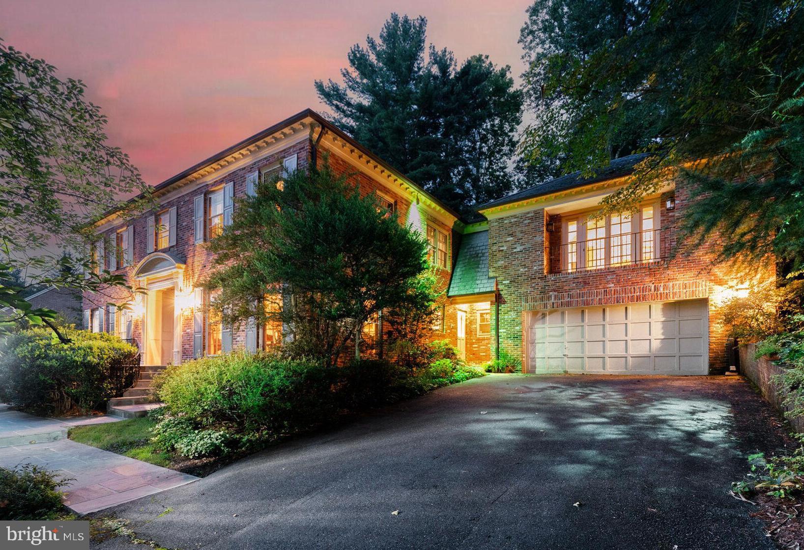 Fabulous opportunity to update and personalize this stately hillside home on a quiet drive in coveted Bannockburn Estates – an ideal property for entertaining on both a grand and intimate scale. The first level features a wide center-hall foyer, an elegant, embassy-sized living room, formal dining room, table-space kitchen, main-floor laundry, a large paneled family room with wet bar and powder room, plus a glass-enclosed sunroom with access to a flagstone patio, multi-level pool area and a wooded path with two more patios above. The second floor boasts four spacious bedrooms and three baths, including an expansive sitting area/office off the primary bedroom with built-ins and storage galore. The walk-out lower level offers a large paneled rec room, full bath and bonus room. With more than 6600 sf of living space, three fireplaces, slate & copper roofing, lush grounds, a double garage, extensive hardscaping, exterior lighting, an in-ground sprinkler system and more, all on a 20,000+ sf lot, this property is truly an oasis to call home.