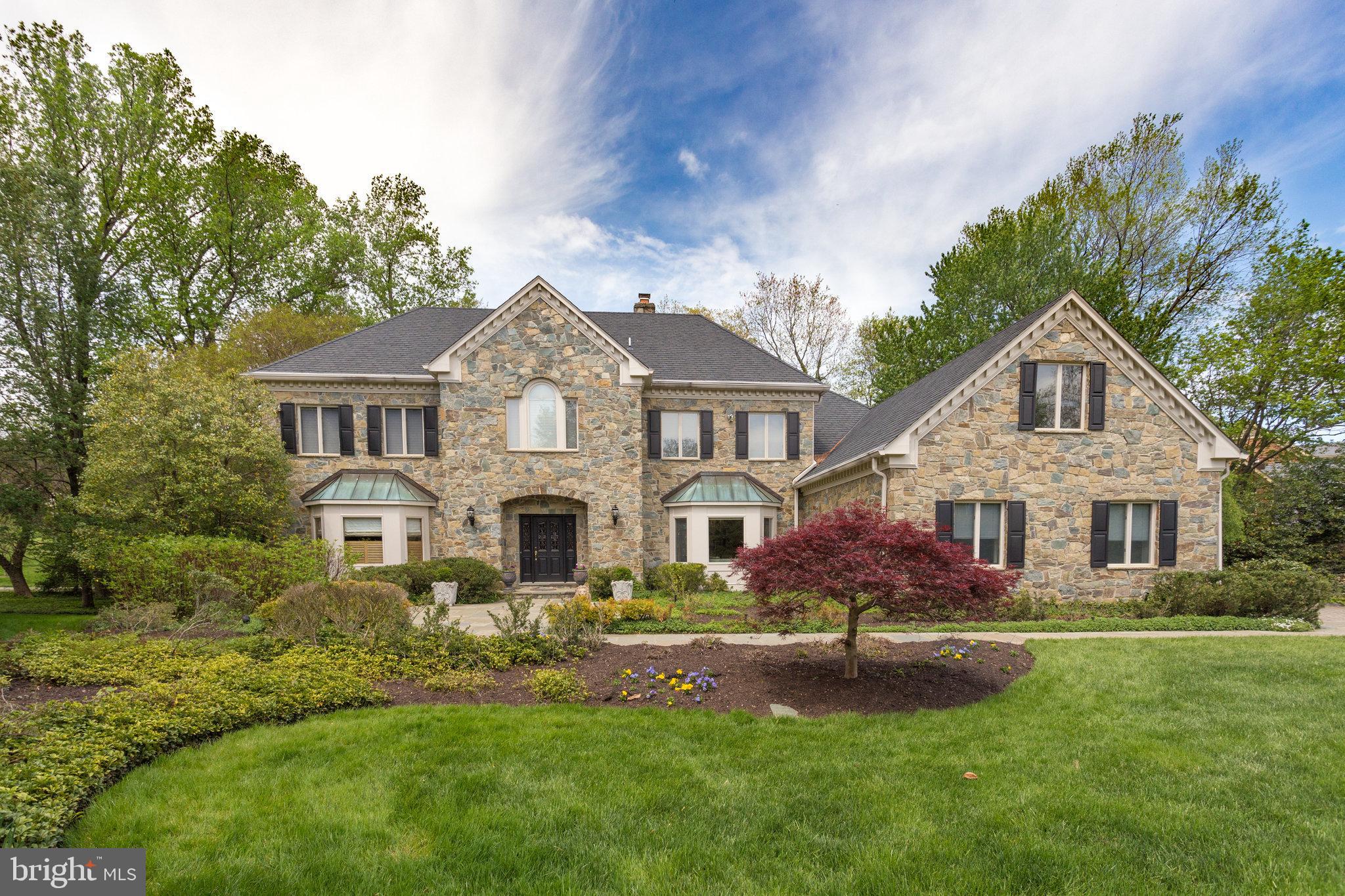 Nestled just off Georgetown Pike near Langley, 938 Douglas is a stunning manor-style colonial offering timeless elegance and modern comfort. Only minutes from Chain Bridge and Washington, DC, this home combines sophistication with convenience.
The Williamsburg-inspired stone façade and grand entry plaza welcome you into a residence filled with light and grandeur. A dramatic curved staircase, expansive bay windows, and spacious interiors define the home. With up to five bedrooms, five full baths, and three half baths, it offers luxurious accommodations, including a main-level primary suite and an upper-level master.
Amenities abound, featuring a full-sized gym, club room, play area, entertainment bar/lounge, and a resort-style wine cellar. Outdoors, elegant gardens, manicured lawns, and a hidden plaza provide a serene retreat and perfect space for gatherings.
Discover a lifestyle of refined living at 938 Douglas. Schedule your private tour today.