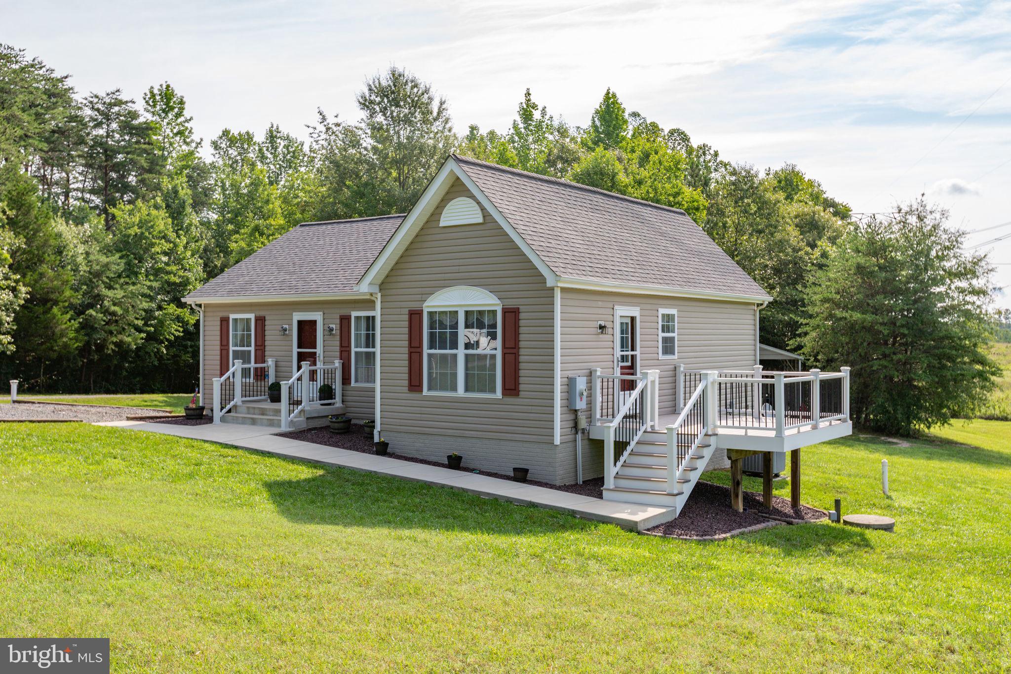 Welcome home! An absolute turnkey retreat where unmatched pride of ownership shines in every single corner. Meticulously cared for and spotlessly clean from top to bottom, this home sits on a private, serene lot spanning over four acres.  The exterior is wrapped in vinyl siding and features a new concrete porch and sidewalk, a maintenance-free Trex rear deck, a 12x16 shed with electricity, and a massive 20x21 pole barn (permitted).

Inside, the home feels brand new, boasting professional two-tone paint across all walls, trim, and ceilings, alongside brand-new carpet and tons of natural light. The living room features beautiful hardwood floors and flows seamlessly into the eat-in kitchen. Perfect for cooking and entertaining, the kitchen comes equipped with a suite of new stainless steel appliances—including a refrigerator with an ice maker, stove, microwave, and dishwasher—and leads directly out to the deck.

The highly desirable split-bedroom floor plan provides ideal privacy. The primary suite features a large walk-in closet and a private full bathroom. On the opposite side of the home, two additional bright bedrooms share a second immaculate full bathroom, located just off the dedicated laundry room. Showcasing pristine mechanics, the home features a new roof, replaced HVAC ductwork, HVAC has 1 year left on warranty and a fully permitted, conditioned, and encapsulated crawl space.

No HOA, plenty of parking for your boat, RV, etc.