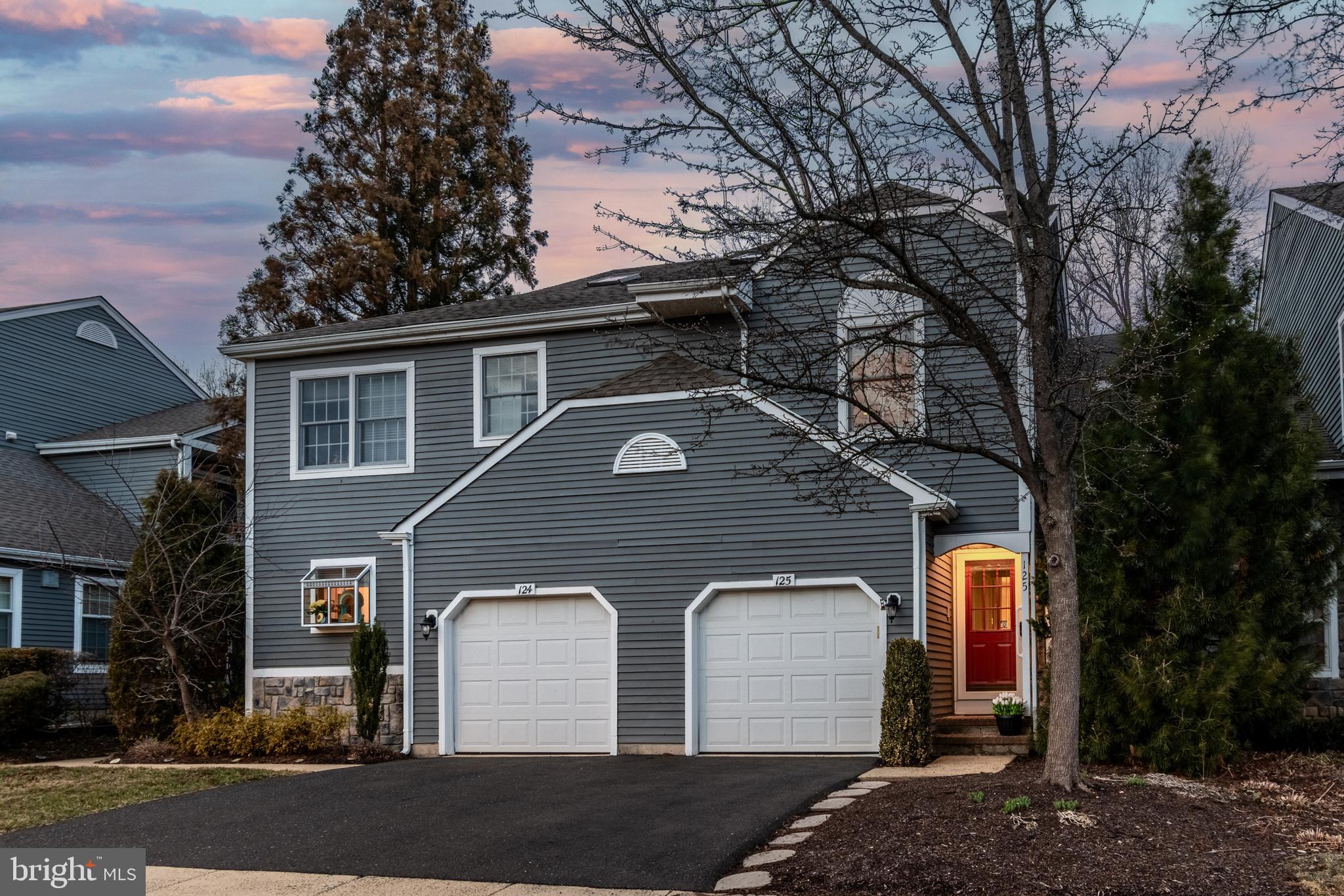 In New Hope’s beloved Fieldstone community on the border of Solebury and New Hope, this spacious townhouse delivers on comfort, space, and convenience. Located in a prime location having serene views of evergreens and meadow stretching beyond the back deck, it also feels much more private than others in the community while being just moments from the vibrant heart of town. Sunlight pours through Palladian arched windows, illuminating the two-story foyer with granite flooring leading into the open concept living, dining and kitchen area.  Beautiful wainscotting and crown molding accentuate the living space. Arched windows flank the cozy wood-burning fireplace with a granite surround and hearth anchoring the living room.  Off the dining room area, sliding doors lead to the rear deck where fresh breezes and peaceful views await. The kitchen blends function and style with a spacious pantry closet, stainless fridge and dishwasher, GE profile gas stove and microwave oven, ample cabinetry, island seating and a seamless flow to the dining and living areas. Completing the main level is a powder room just off the foyer accented by a granite vanity.  Upstairs, a versatile loft creates an extra place to work and relax with convenient laundry access and a linen closet. A generously appointed main bedroom and private bath features both a walk-in closet with organizers and a double closet. Its en-suite bath includes a double vanity with granite countertops, decorative tilework, a glass shower enclosure and a deep soaking tub. The second bedroom, tucked behind double French doors, overlooks the rear open field, offers a vaulted ceiling with two skylights and has its own bath with a stall shower and sizable walk-in closet with organizers. The finished lower level extends the home’s living space with a comfortable family room, an exercise room, and a designated abundant storage space. Additional storage can be found in the neatly organized one-car garage. Set within one of New Hope’s most sought-after communities with easy access to the heart of both award winning historic river towns, filled with boutiques, acclaimed restaurants, and the scenic Delaware River, this special home offers the best of town and country living all within the New Hope Solebury School District! This home is being sold in AS IS condition.