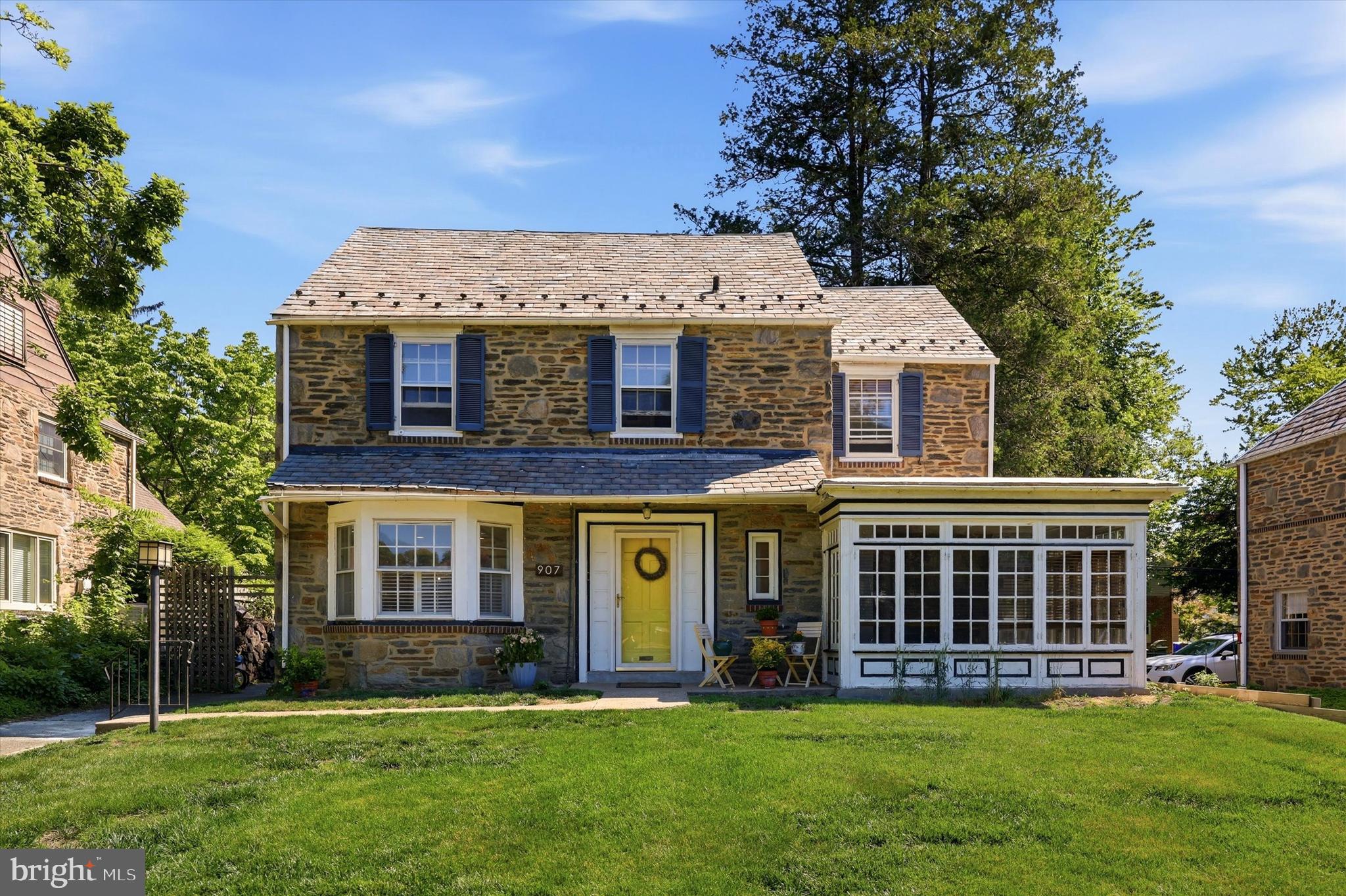 Welcome to this classic stone Colonial in the highly desirable Melrose Park neighborhood, where timeless charm meets thoughtful updates. The renovated kitchen serves as the heart of the home, while a beautiful wood-burning fireplace creates a warm and inviting focal point in the living room.

Beautiful hardwood floors run throughout the home, with additional hardwood flooring preserved beneath the second-floor carpeting. The spacious bedrooms offer generous closet space, providing plenty of room for storage and everyday living. The updated hall bathroom and primary bathroom provide modern comfort and style.

The inviting living room opens to a bright enclosed porch surrounded by windows, creating the perfect space for morning coffee, a reading nook, or additional entertaining space. Just off the kitchen, you'll find a versatile office/gym area that adds valuable flexible living space to fit your lifestyle.

The partially finished basement offers additional space for recreation, a home office, or storage. Recent major improvements include the replacement of the heater, central air conditioning system, hot water heater, and electrical panel, providing added peace of mind for the next owner.

Additional highlights include a durable slate roof, a private driveway, and abundant off-street parking. Combining classic architecture, modern updates, and generous living space, this Melrose Park gem is ready to welcome its next owner home.