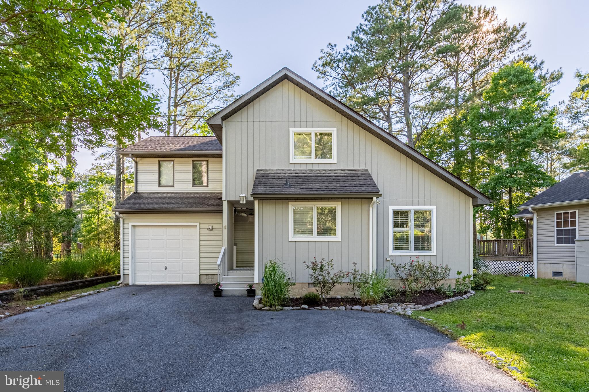 Experience peaceful waterfront living with beautiful sunset views over Manklin Creek. Located in the desirable Nantucket section of Ocean Pines, this charming 3-bedroom, 2.5-bath home with a 1-car garage offers comfort, coastal charm, and natural beauty.
Inside, the spacious great room features a vaulted ceiling, fireplace, and abundant natural light, creating a warm and welcoming gathering space. The kitchen is nicely appointed with luxury vinyl plank flooring, granite countertops, stainless steel appliances, and plenty of functionality for everyday living or entertaining. Step outside to enjoy the new deck, spacious backyard, and your dock/pier leading to the water, ideal for fishing, crabbing, relaxing, or simply taking in the tranquil scenery. The large screened porch is a wonderful place to unwind or entertain while enjoying the peaceful waterfront setting. Tucked away on a cul-de-sac with a paved driveway, the home offers added privacy, convenience, and curb appeal.
Additional improvements include an encapsulated crawl space with French drains and a dehumidifier, offering added peace of mind. Whether you are looking for a primary residence, vacation getaway, or investment property, this waterfront retreat delivers comfort, value, and unforgettable views in one of Ocean Pines’ most serene settings.