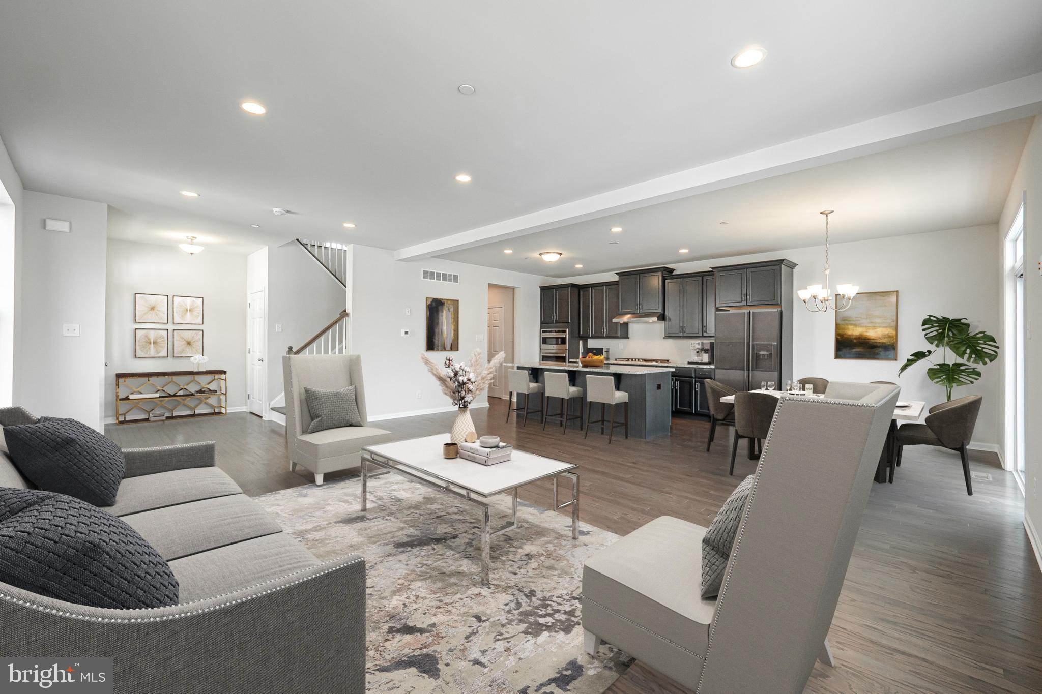 Offer deadline is Wednesday, May 24, 2023. The Thompson Elite Craftsman floor plan provides plenty of space for your busy lifestyle with the convenience of townhome living The expansive open floor plan invites your guests to relax by the large island for informal gatherings and holiday feasts alike. Sliding doors off the dining area provide easy access to the deck. Storage is plentiful, as the Thompson offers a large pantry and mudroom conveniently located between the kitchen and two-car garage. Upstairs, in your primary bedroom retreat, choose between one oversized walk in closet, or dual walk-ins with a dressing room adjoining your private primary bath. Two additional bedrooms, a hall bath, and laundry closet complete the upper level. East Village is located in the award-winning Downingtown School District. Residents of East Village will enjoy resort style amenities including a community pool, clubhouse with gathering room and a fitness center, sidewalks, walking trails, and a playground. Note that this home is to be built and photos are of a similar model.