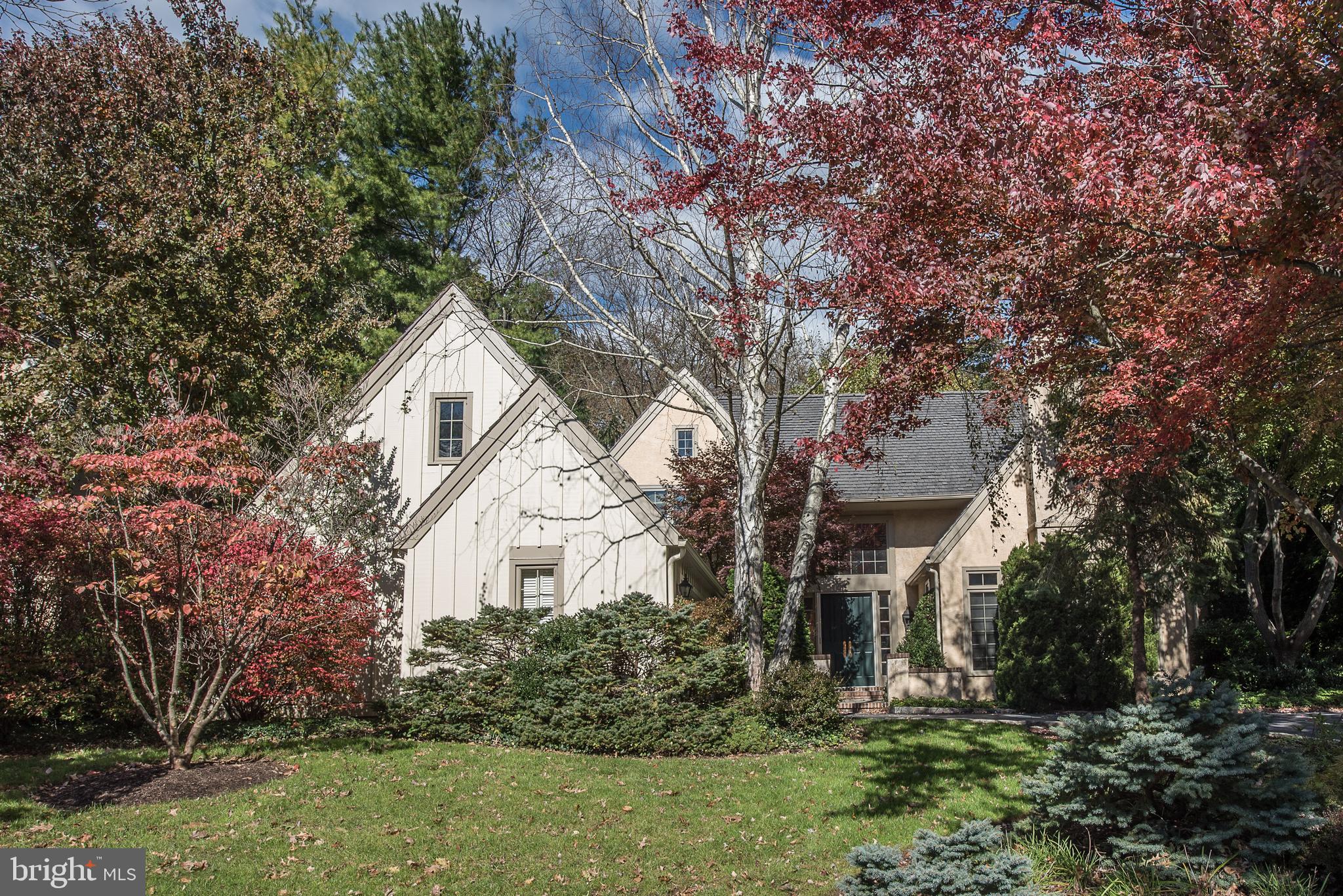 It is no secret that Denbigh remains a very popular and sought after enclave among Buyers today seeking a tranquil, natural setting with gently sloping meadows, a winding stream and beautiful mature trees, walking paths and no through traffic. A private and almost secluded sanctuary in which to live, among just a few others. Its 19087 location allows for very easy and efficient access to almost everything one may want or need - a major convenience today. The Upper Merion Township location provides welcome relief from higher, adjacent property tax assessments.  Welcome to 1229 Denbigh Lane, a Brighton model, with a premium,  inner circle lot location for commanding views to the front, backing to open space for easy access to the grounds and trails, to peace and privacy, just out the back door. The private courtyard driveway allows for an oversized, attached, side set, two car plus garage. This fantastic Brighton floorplan has become a classic - well lit, with a slightly formal bearing, with great space allocations, but allowing for casual and easy, day-to-day living w excellent flows. Exceptional natural lighting with abundant sunshine, and easy access to the out of doors.  The amenities abound. Two story entrance foyer with large, south facing transom window. Double entrance doors, hardwood floors throughout the first floor, a library/den with built ins and a stone fireplace.  Two story family room is immediately adjacent, open to the kitchen and breakfast room, and offers oversize sliding doors to the large, rear patio, and a stone fireplace hearth and floor to ceiling stone accent wall. White on white kitchen has breakfast area and counter seating. Oversize bluestone rear patio has a little pond and fountain, and glass doors to access to the Dining room, Family room and a gate to the meadow and walking path at the rear. Step down Living room has third stone fireplace, good scale and great windows, and opens completely to Dining room and Foyer.  Stairs to the second floor, with open landing and three bedrooms, each with very large closets, two and one half bathrooms.  Owner's bedroom suite has pretty windows, double doors, dual walk-in closets, soaking tub, private WC and stall shower en suite.  The first floor laundry room has transom mudroom with storage and coat closets, and interior access to heated, two car attached garage.  The full, unfinished lower level has excellent storage capacity and potential to further finish, with a workshop, a fitness room and a cedar closet. The very well run HOA attends to all of the landscaping, plowing and maintenance work necessary to keep both the house and community in top notch shape. If easy and elegant living in a parklike environs appeals to you, please come and see this great opportunity at 1229 Denbigh Lane.