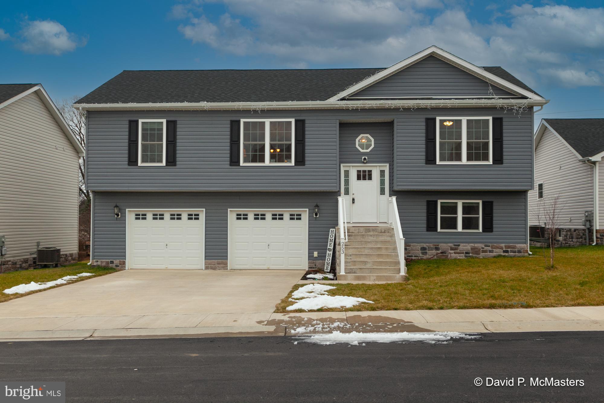 MOTIVATED SELLER - BRING ALL OFFERS! This one is not like the others! Nearly new construction in desirable Red Hill featuring 4 spacious bedrooms and 3 full baths, large 12x24' rear screened porch, composite rear deck w/stairs too the privacy-fenced rear yard. Swing set and trampoline can stay if you'd like them! Built in 2021, this home shows beautifully and is wonderful for entertaining. From the two story foyer you head upstairs to the generously sized great room with open concept floor plan. Enjoy relaxing on the screened porch after work. All main living areas upstairs feature luxury vinyl plank flooring. The tree upstairs bedrooms are carpeted and the Great room and primary suite have ceiling fans. There are also two large walk-in closets in the primary suite with an attached bath w/double sinks, soaking tub and separate shower. The tastefully designed kitchen features a center island with breakfast bar, granite counters, under cabinet lighting, stainless appliances and a nicely sized pantry. The lower level features a carpeted 4th bedroom with an attached full bath of it's own, the laundry room is unfinished with a front load washer and dryer that convey. This level provides interior garage access as well. Please read the directions as the street sign incorrectly states "Dr". instead of "Ct." - we are in process of getting this corrected. And please do not use Apple Maps - they pinned the incorrect location but Waze and Google work great! Coming in on Orpington is your best and easiest route. Must have an appointment to tour.
